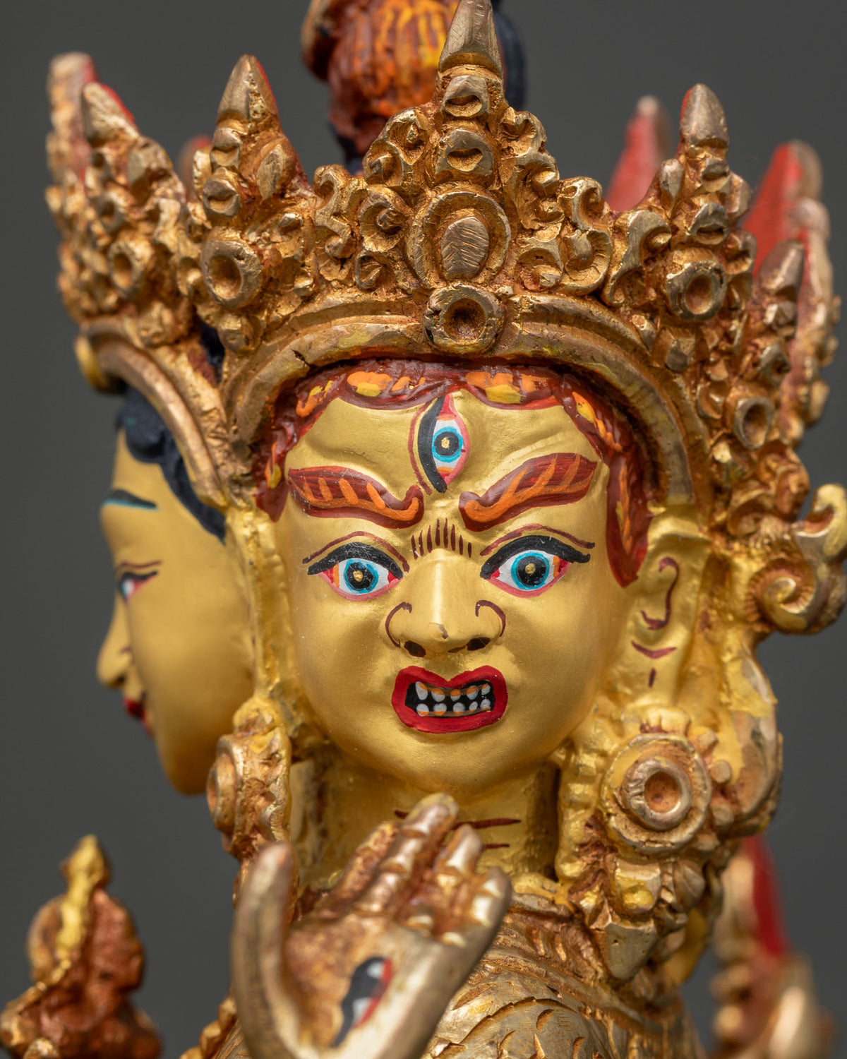 Close up view of Namgyalma Statue with gold painted face and ornate crown