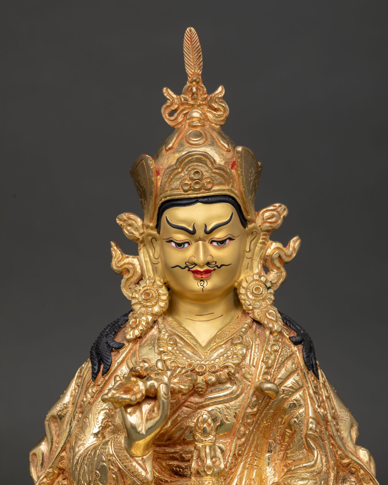 Close-Up view of Tsokye Dorje face revealing fine hand carved details gold painted expression and himalayan buddhist craftsmanship