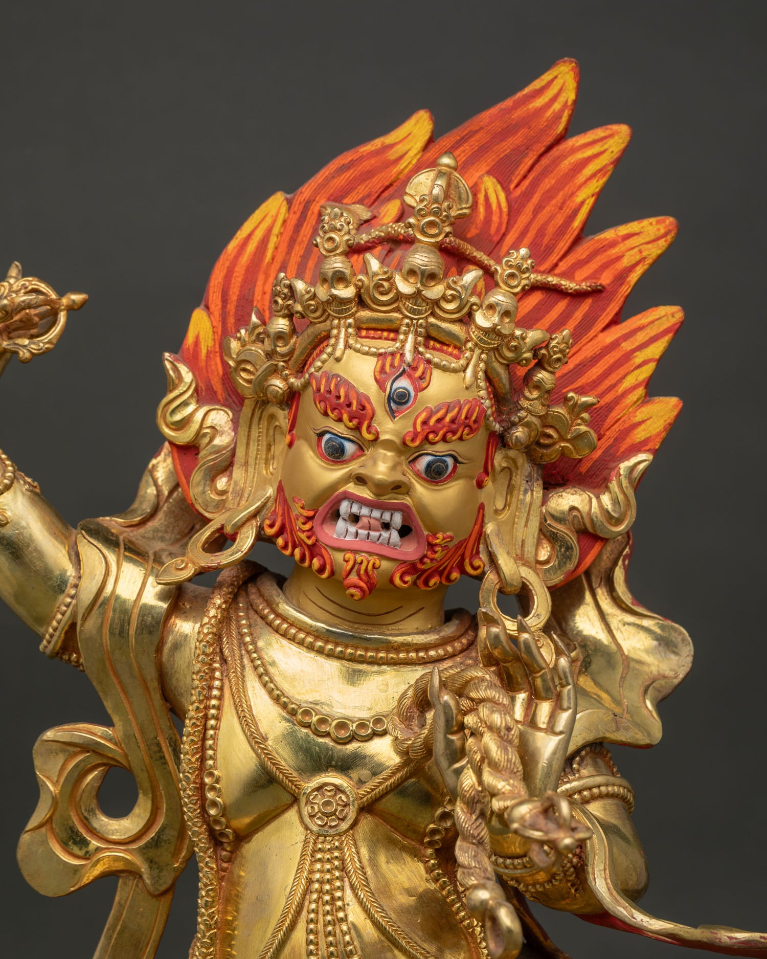 Close Up View of Vajrapani Statue with Wrathful Gold Painted Face