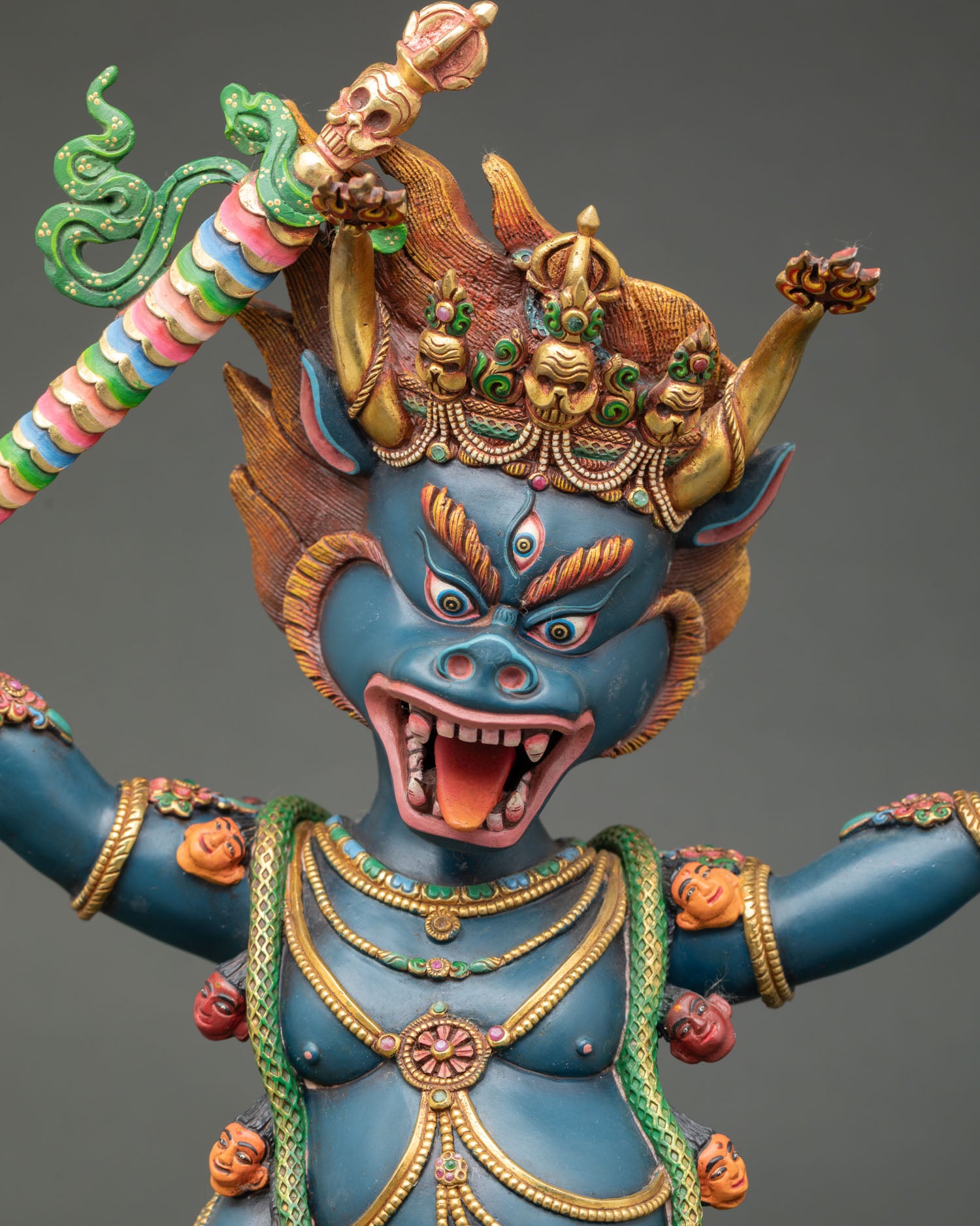 Close-up view of Yamantaka sculpture showing fierce expressions, hand-painted acrylic colors, and intricate Himalayan Newari craftsmanship