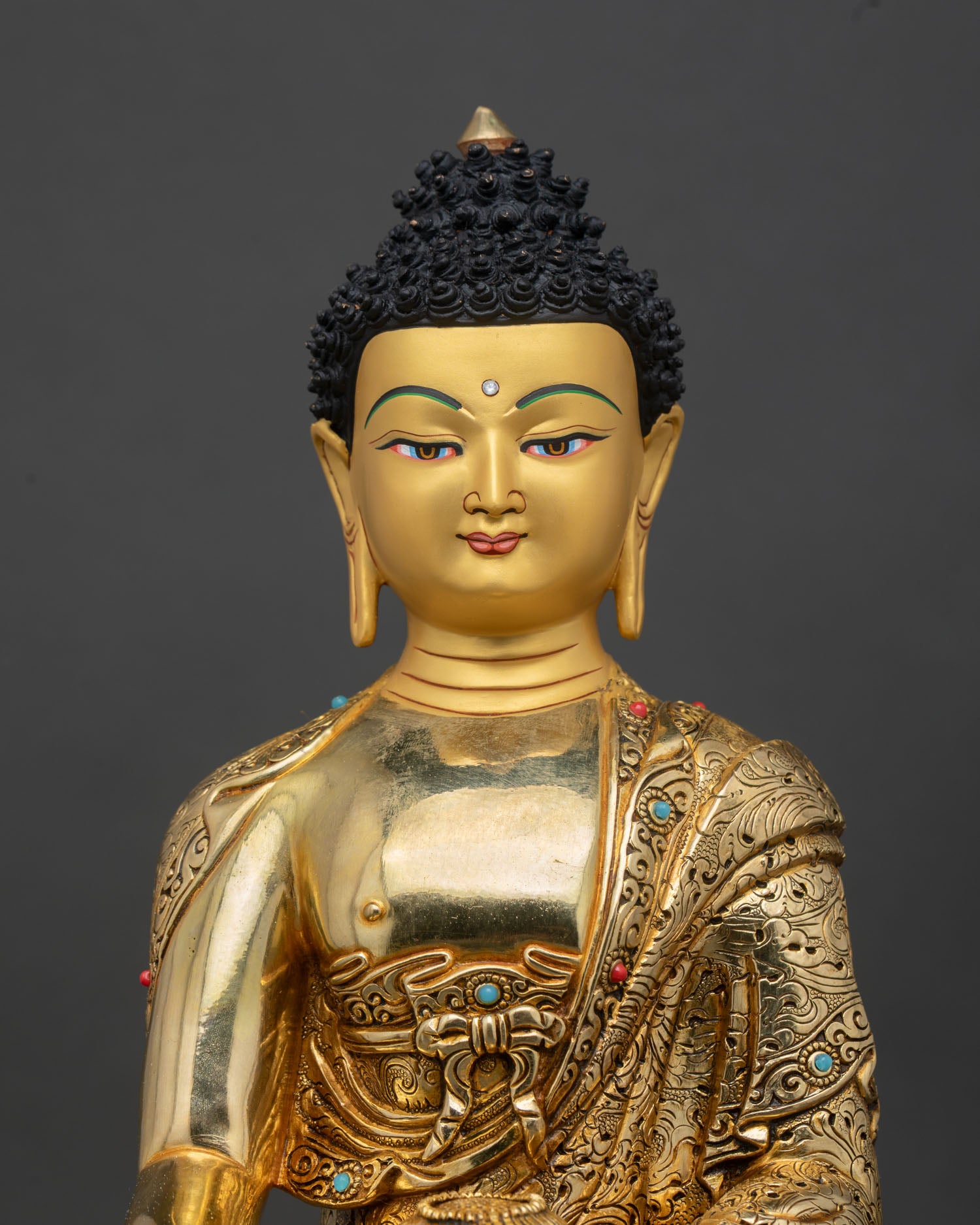 close up view shakyamuni buddha statue intricate nepalese copper gold gilded detail craftsmanship sacred buddhist art