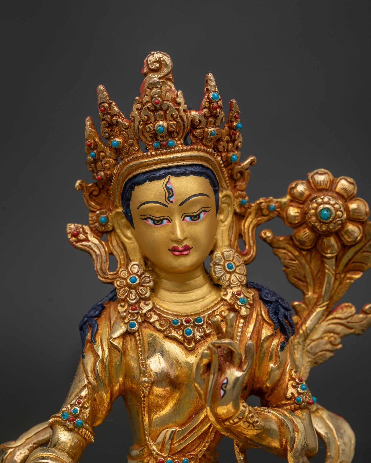 Close Up White Tara Statue Gold Painted Face with Seven All Seeing Eyes Details.