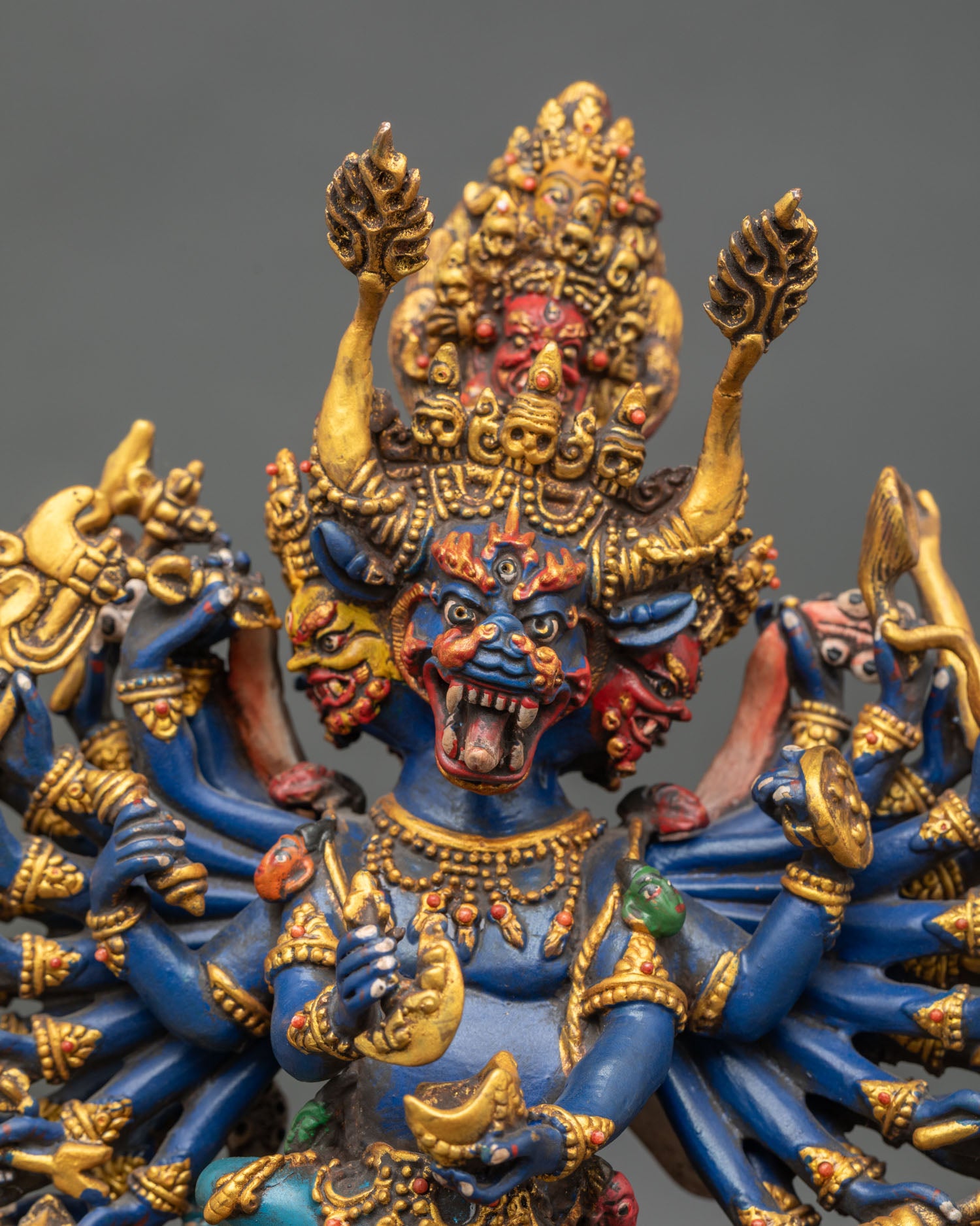 Close up Yamantaka statue kartika knife kapala skull garland intricate carvings Vajravetali blazing halo