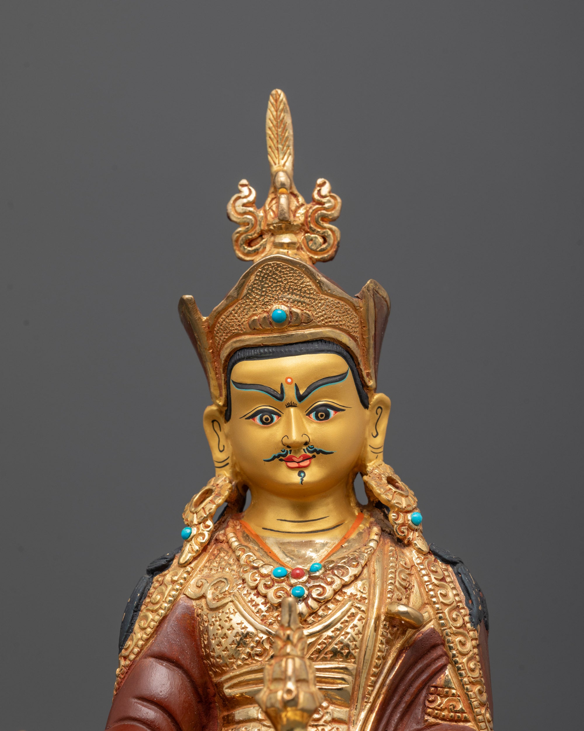close-up Guru Rinpoche face with crown, lotus hat, and lost wax detailing from Patan artisan