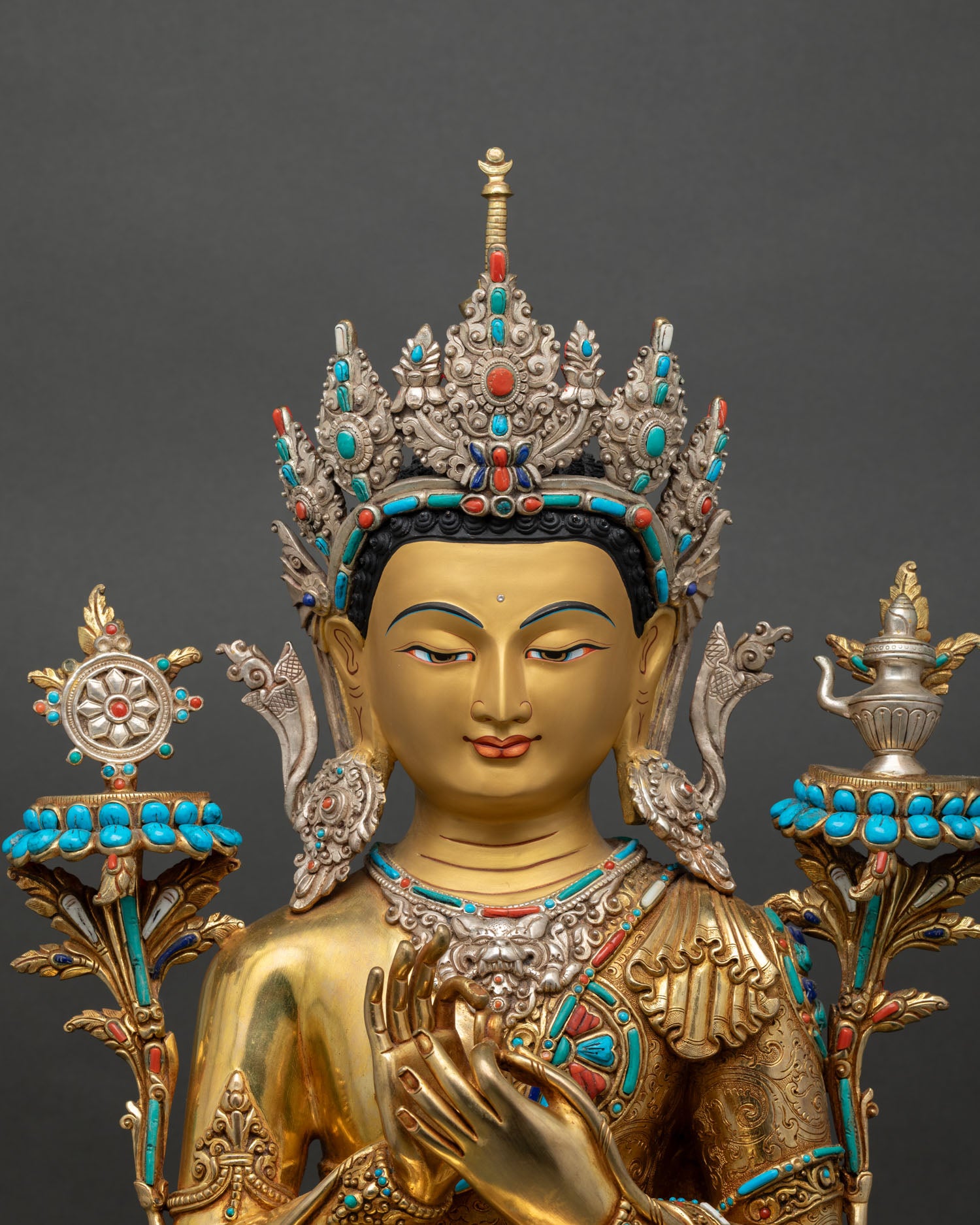 Close up Maitreya Buddha Statue showing intricate copper craftsmanship, gold gilded finish, Nepal art