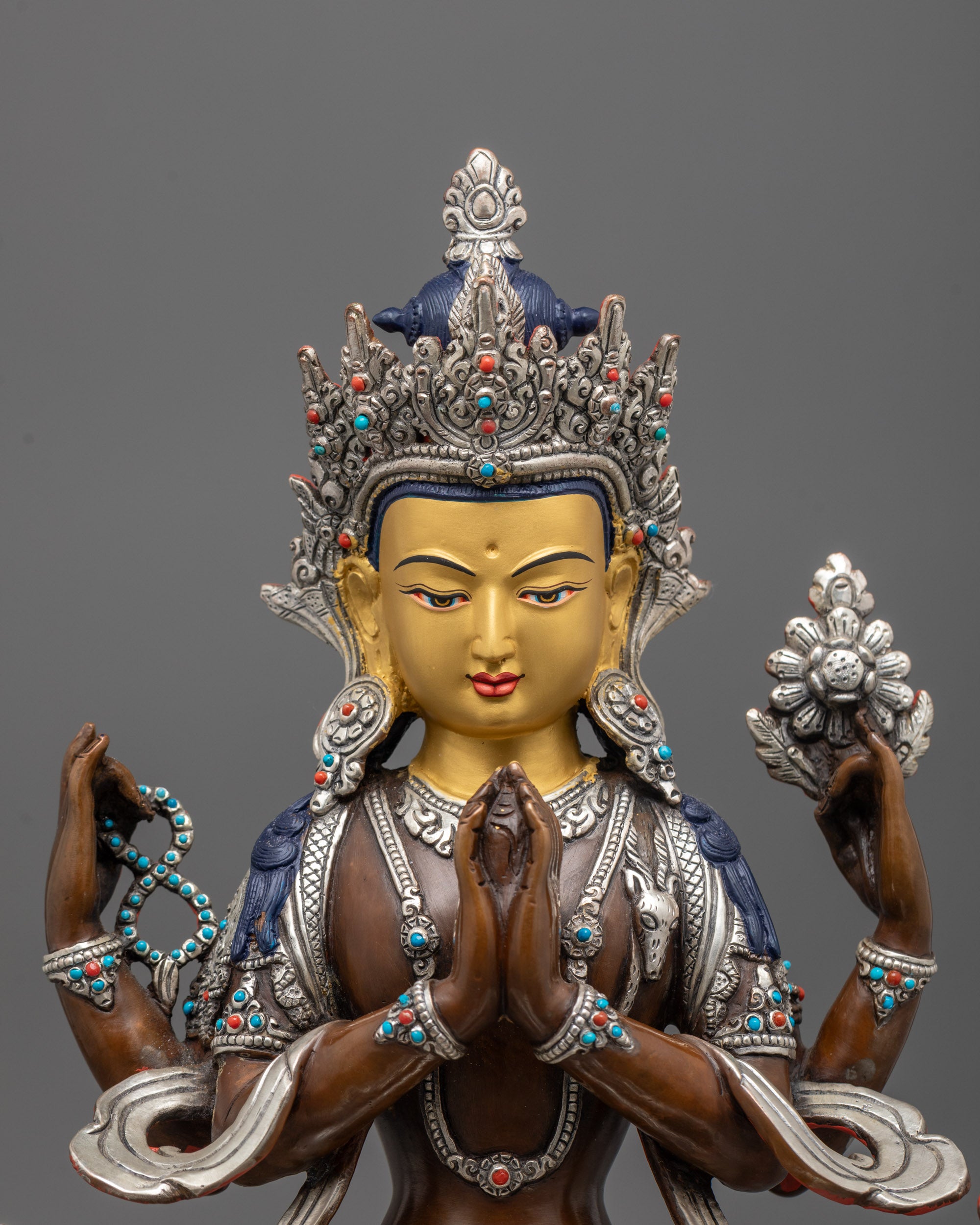 close-up of Chenrezig’s face, 5-jeweled crown, and silver-plated wish-fulfilling gem