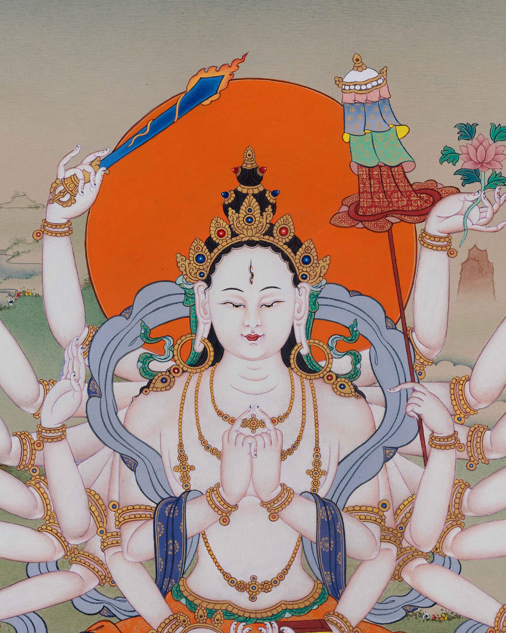 close-up of Chundi thangka highlighting jeweled crown, serene face, and swirling silk robes