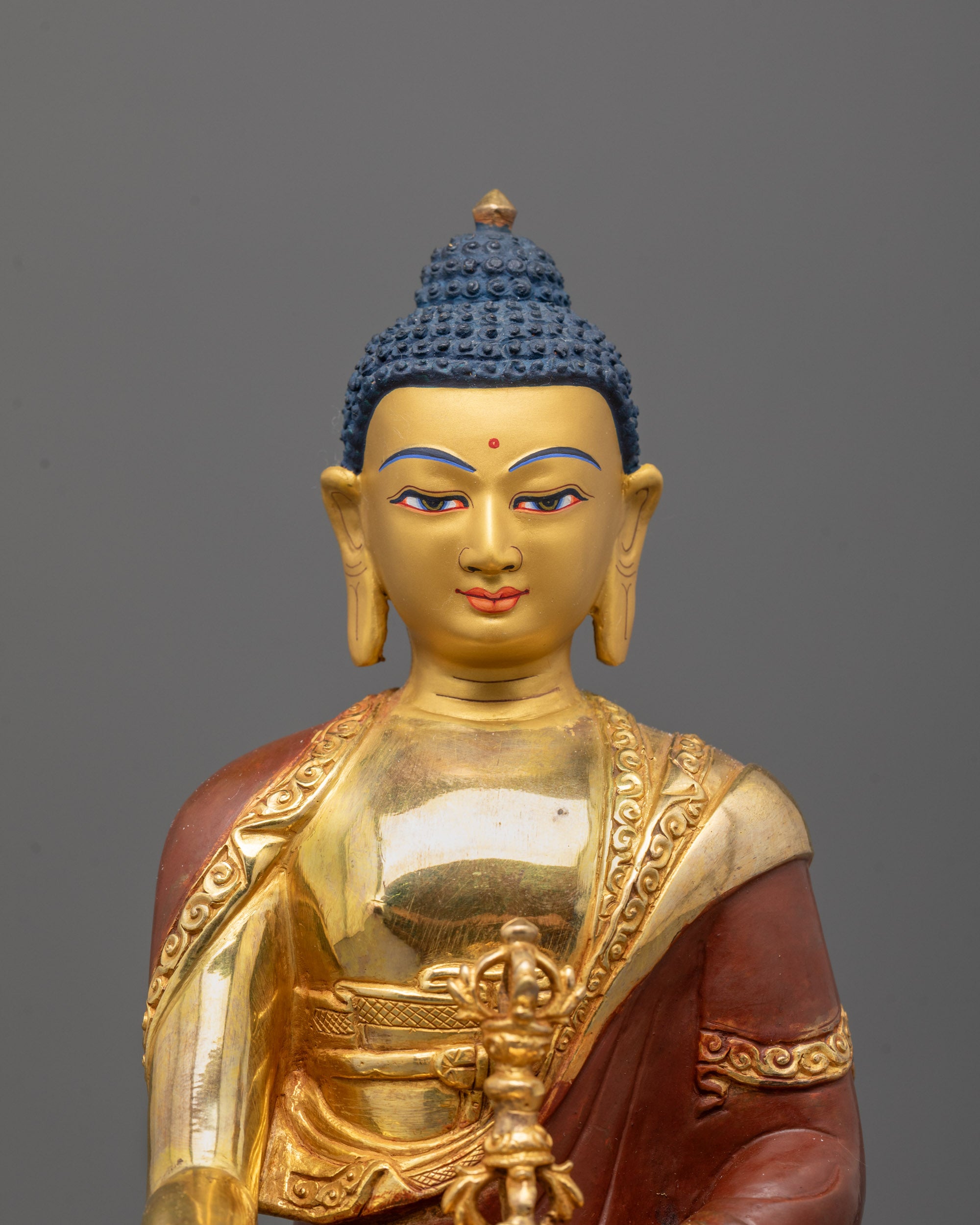 close-up of Mitrugpa face and crown with intricate fire-gilded detailing and sacred expressions