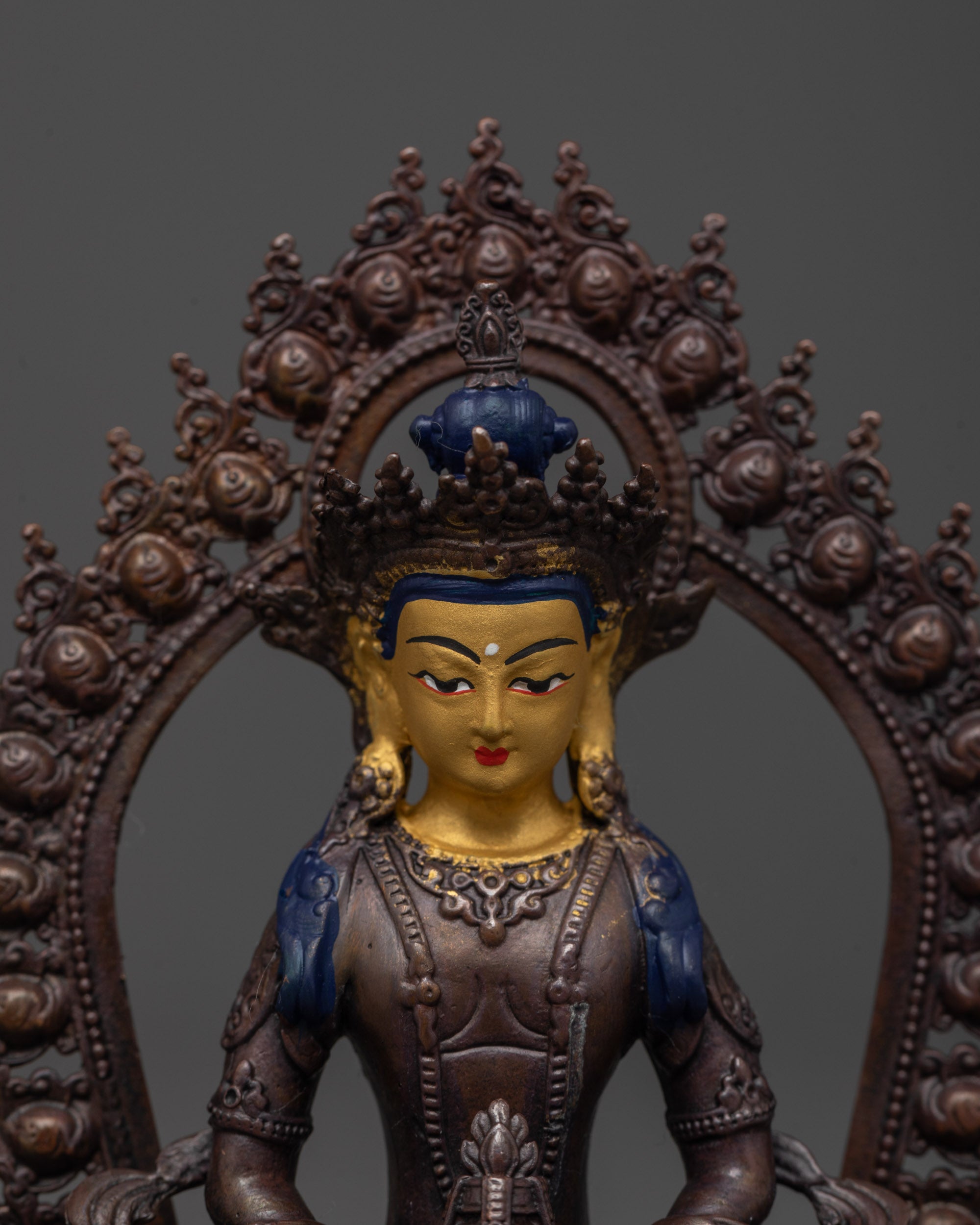 close-up of amitayus holding nectar vase with flowing robes and halo details