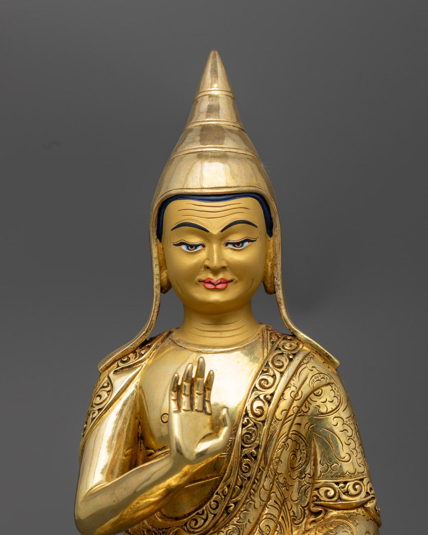 close up Santaraksita statue holding Vajrayana scriptures and performing abhaya mudra