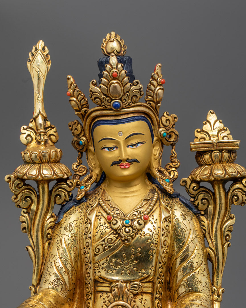 close up Trisong Detsen statue showing detailed jewelry, robe motifs, and serene expression