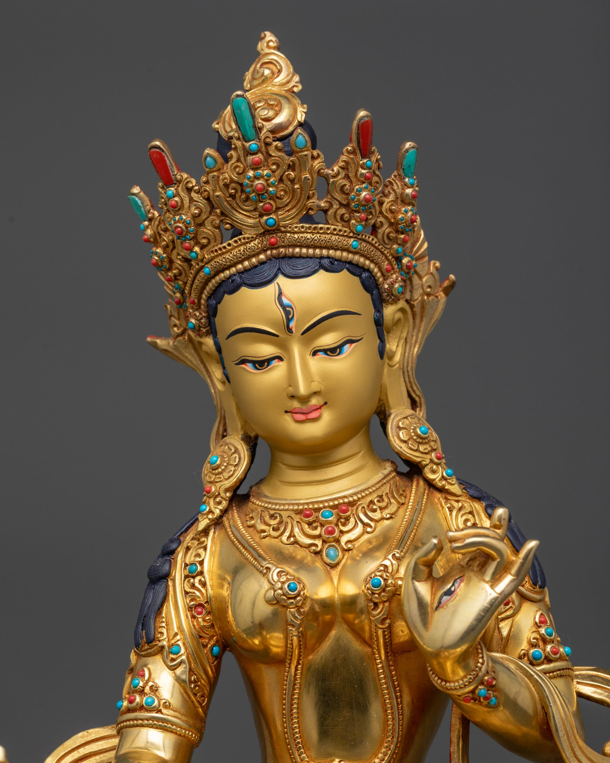 close up Ushnisha Sitatapatra parasol and wisdom wheel with semi precious stones