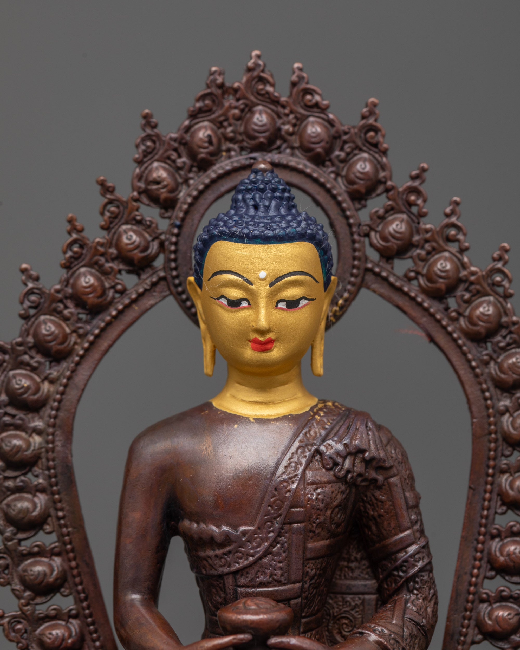 close up of amitabha buddha holding monk’s bowl with carved robe and dhyana mudra