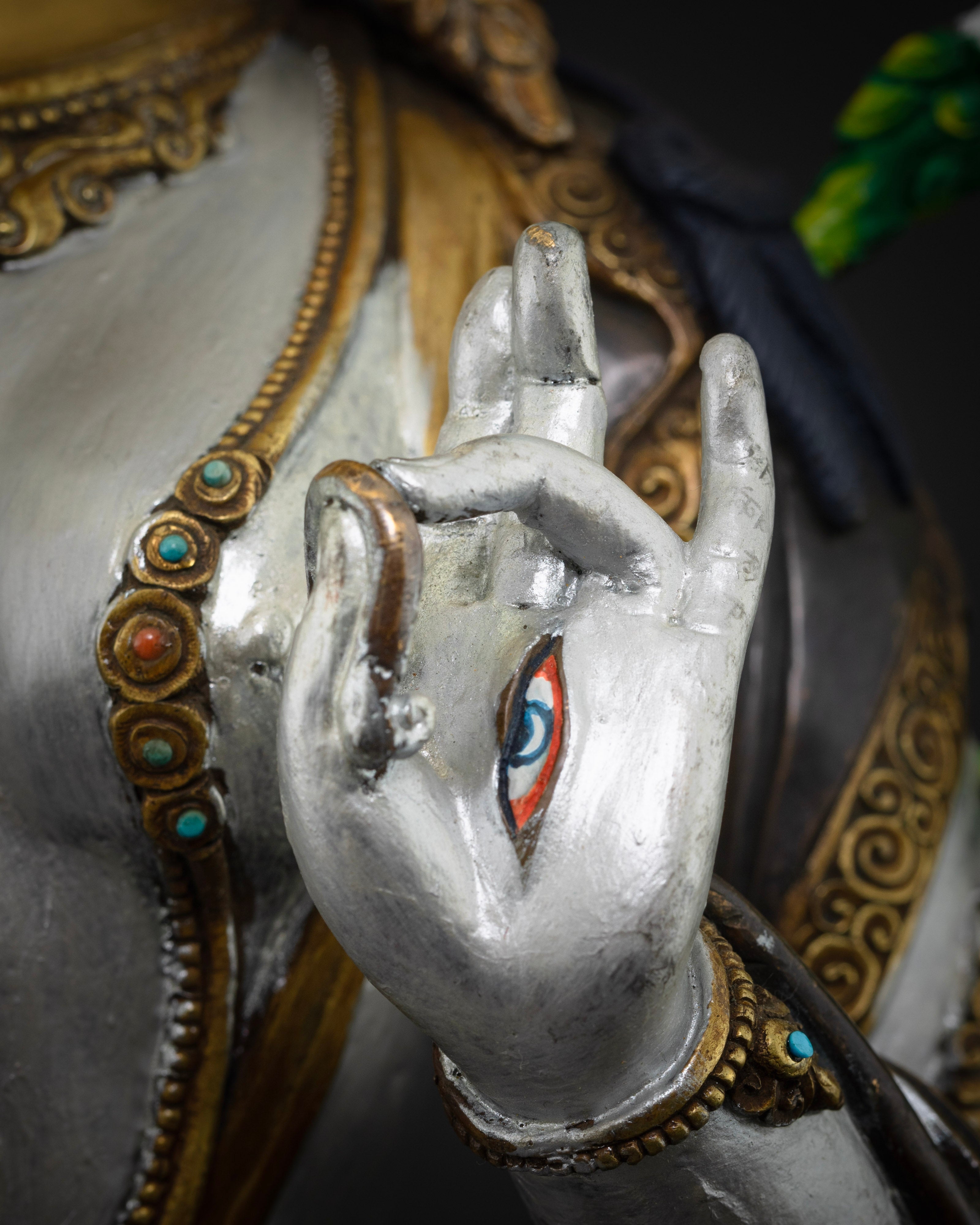 eye in another palm of masterpiece colorful white tara statue