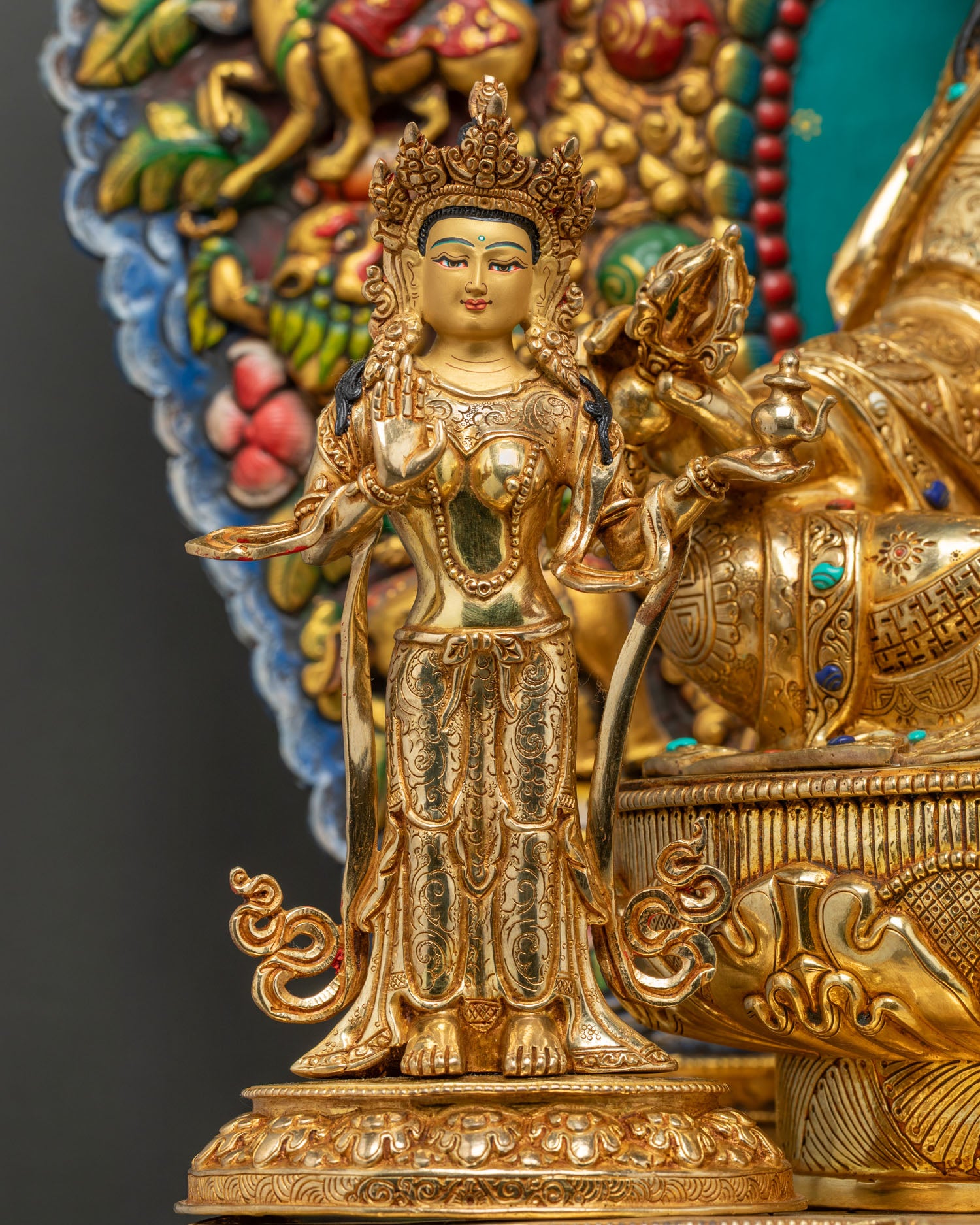 Close-up of Mandarava consort figure on Guru Rinpoche throne statue
