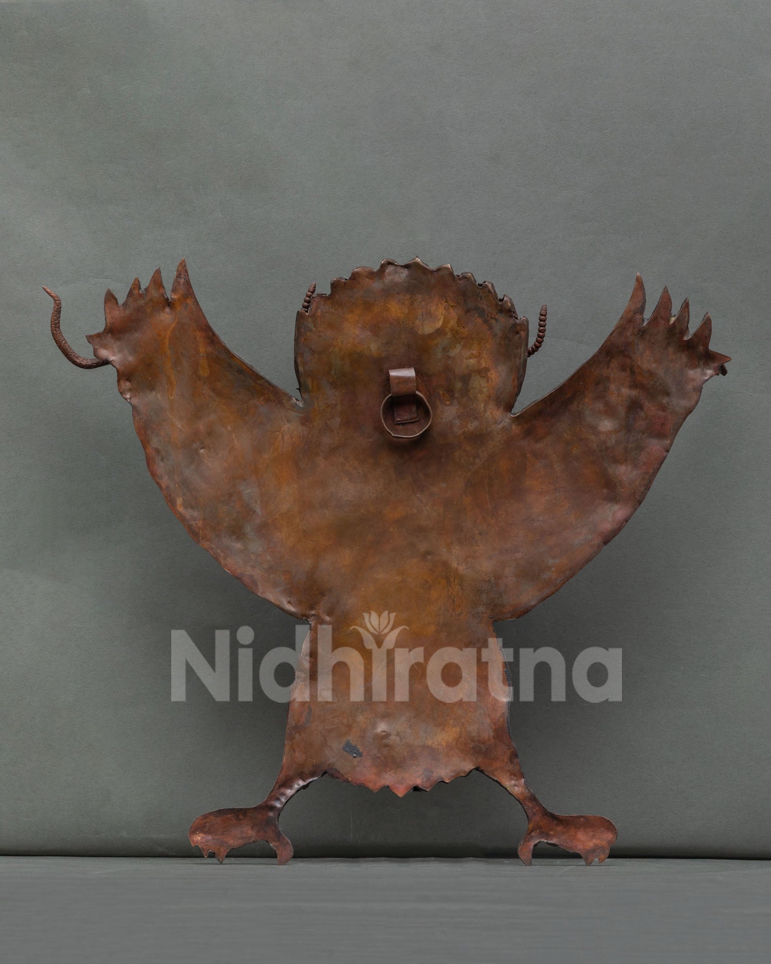 Copper Garuda wall hanging showing strength courage and protection in Nepalese art