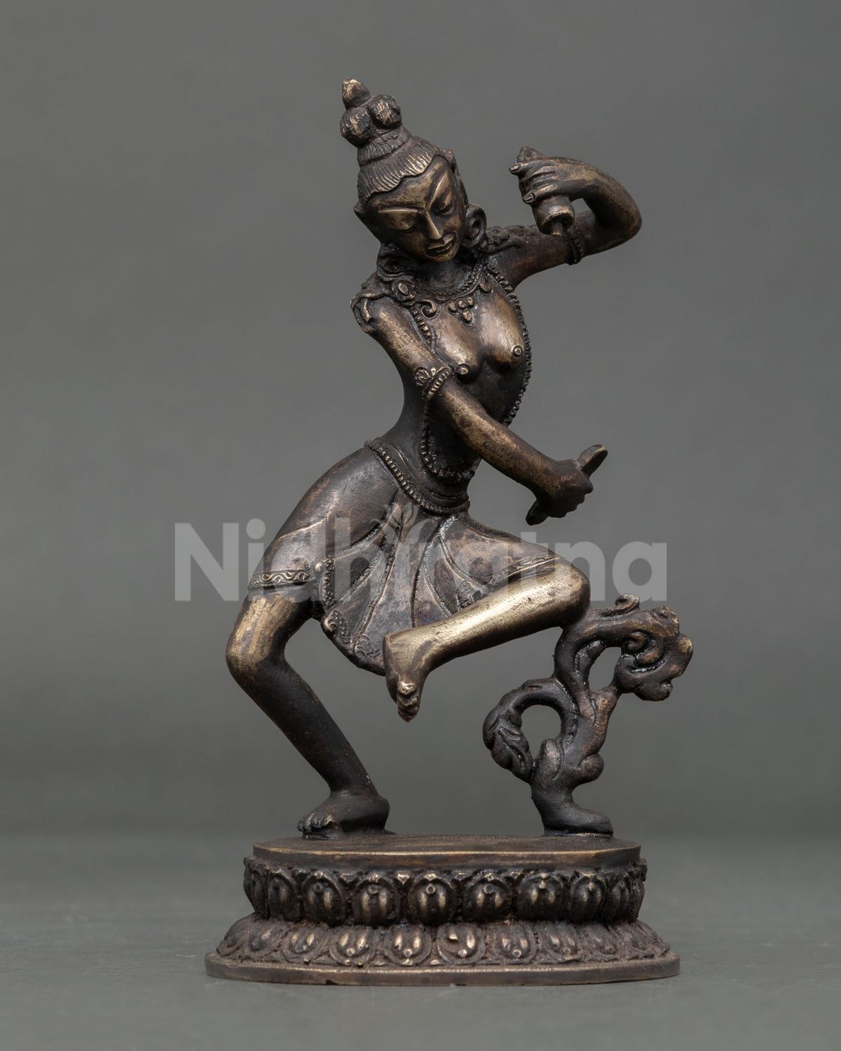 Dancing Cintamani Lokeshvara statue pair with detailed jewelry and flowing scarves