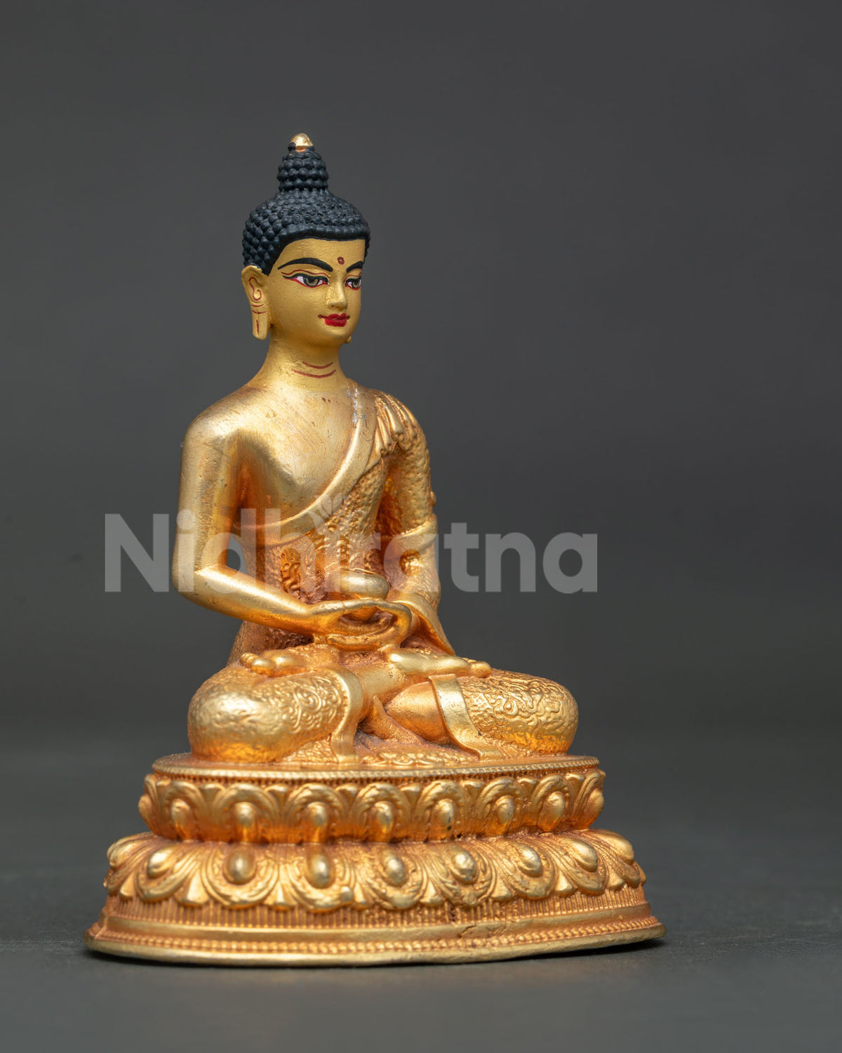 Detailed amitabha buddha statue robe with intricate floral motifs and gold fire gilded finish