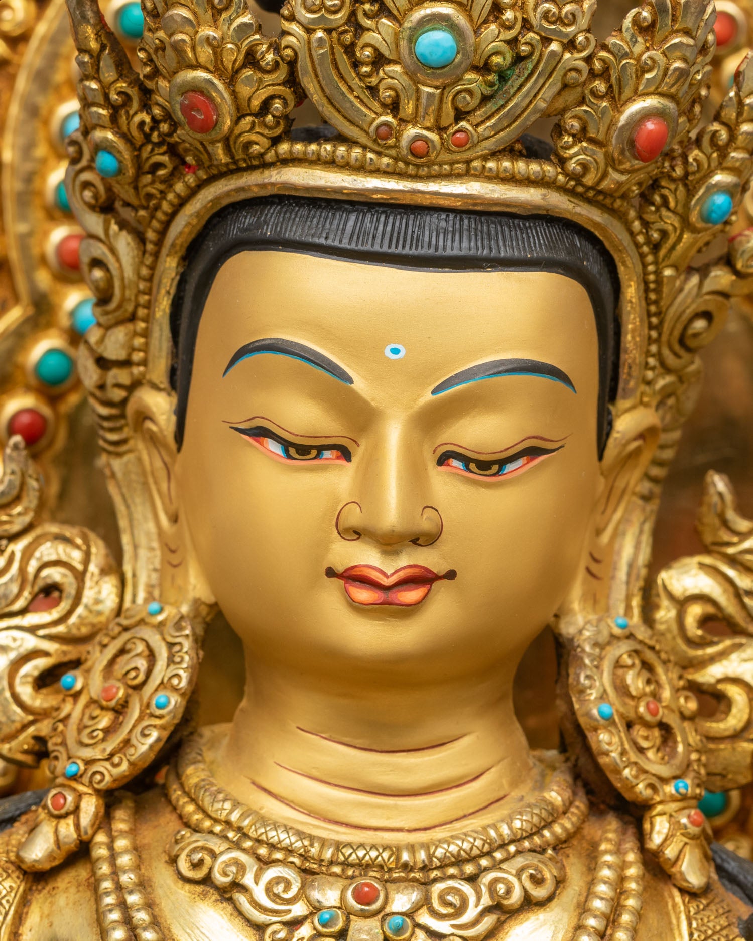 serene manjushri face, copper sculpture with 24k gold and jewelry details