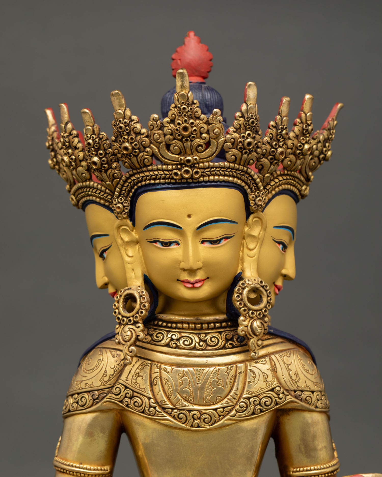 Detailed close up face of vairocana buddha with serene expression, jeweled crown and fine gold finish