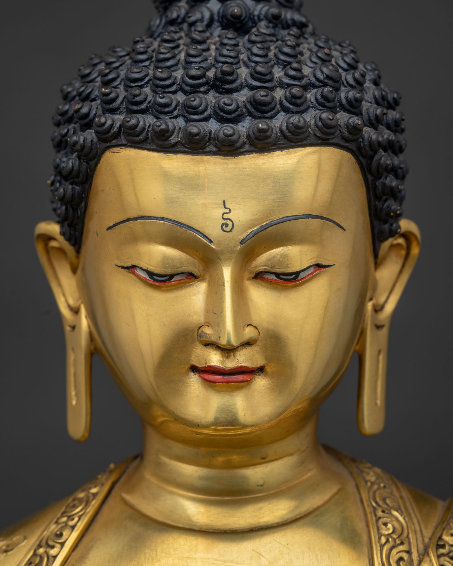 detailed face close up of 24k gold shakyamuni buddha statue newari craftsmanship nepal