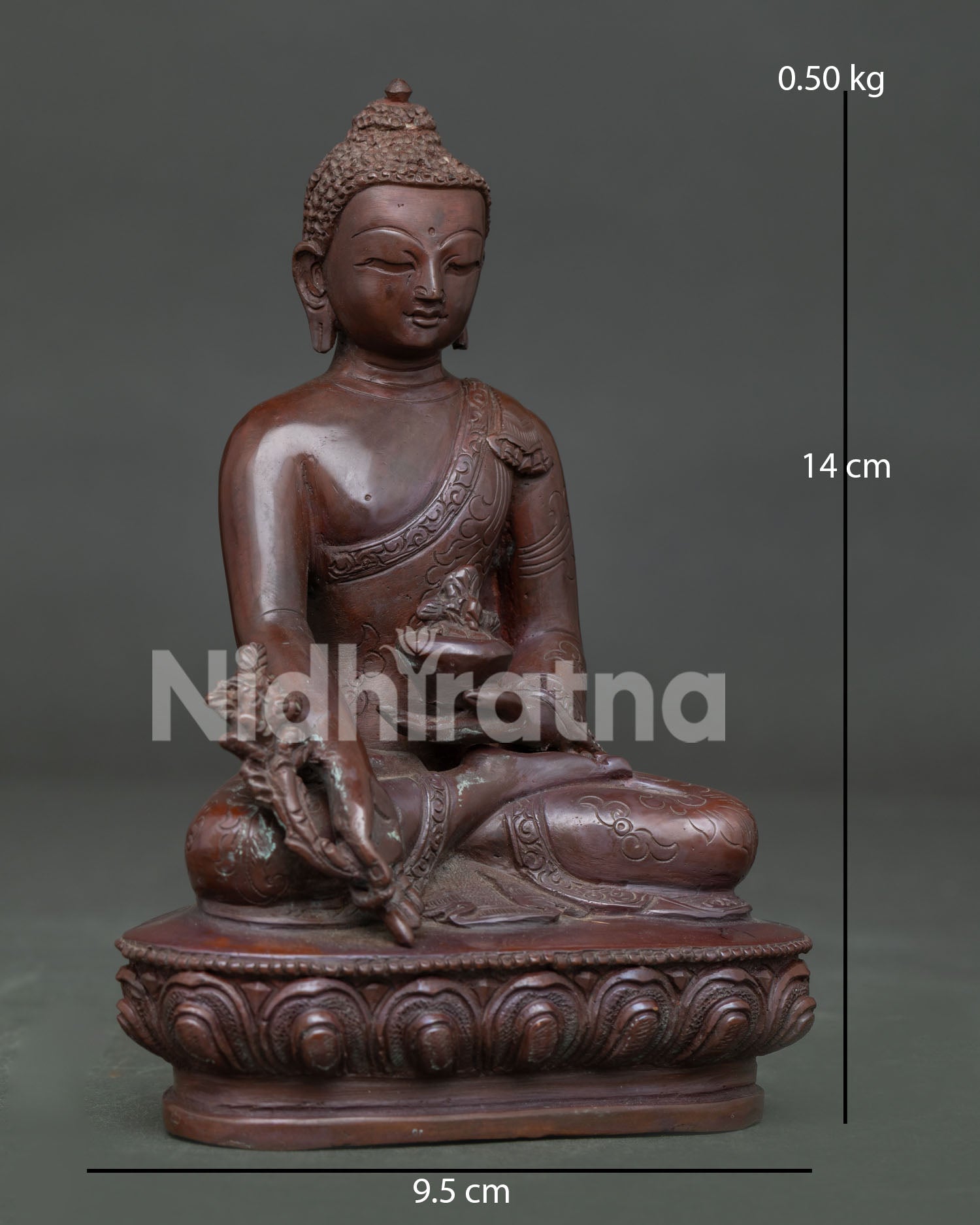 Detailed face of Medicine Buddha Statue with serene expression and hand-carved monk's robe.