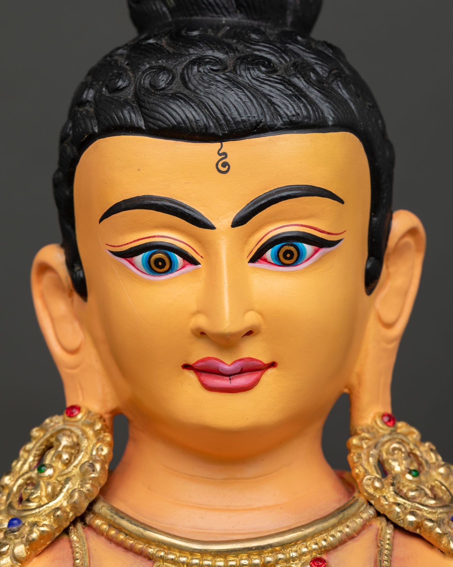 Detailed face of Young Buddha Saving the Swan gold gilded Buddhist statue