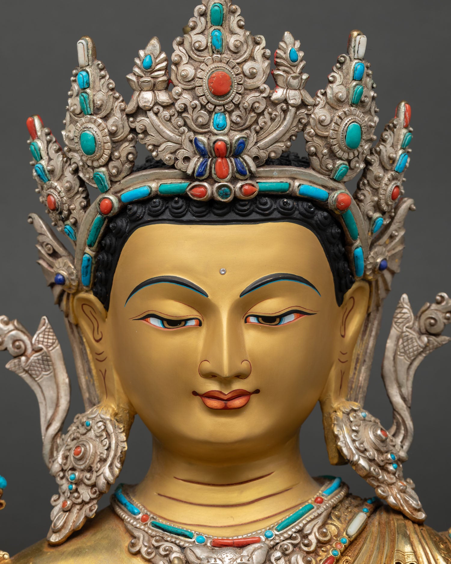Detailed face close up Maitreya Buddha Statue, serene 24K gold painted expression with sacred stone inlays