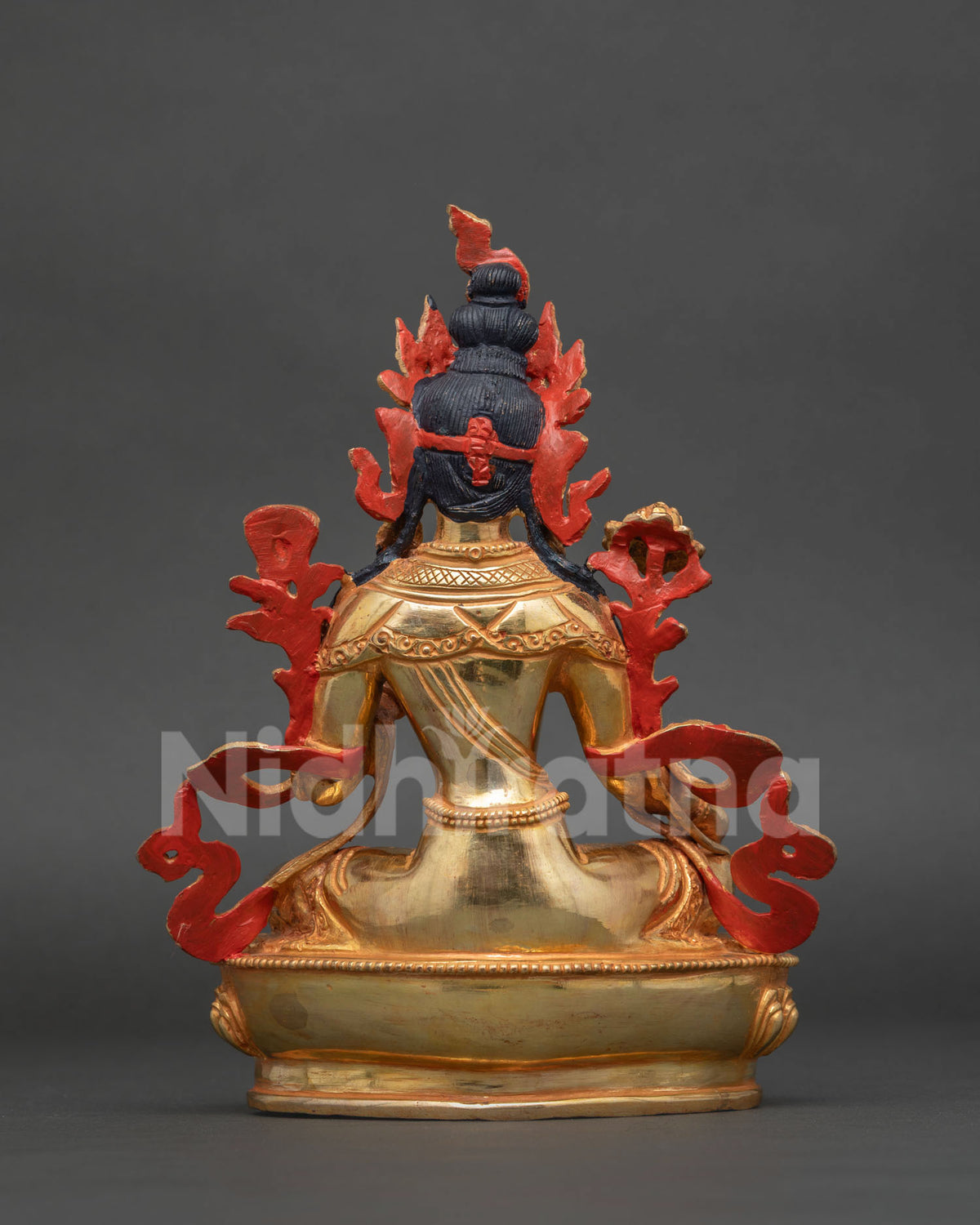 Detailed Green Tara buddhist statue handcrafted by newari artists with sacred utpala flower.