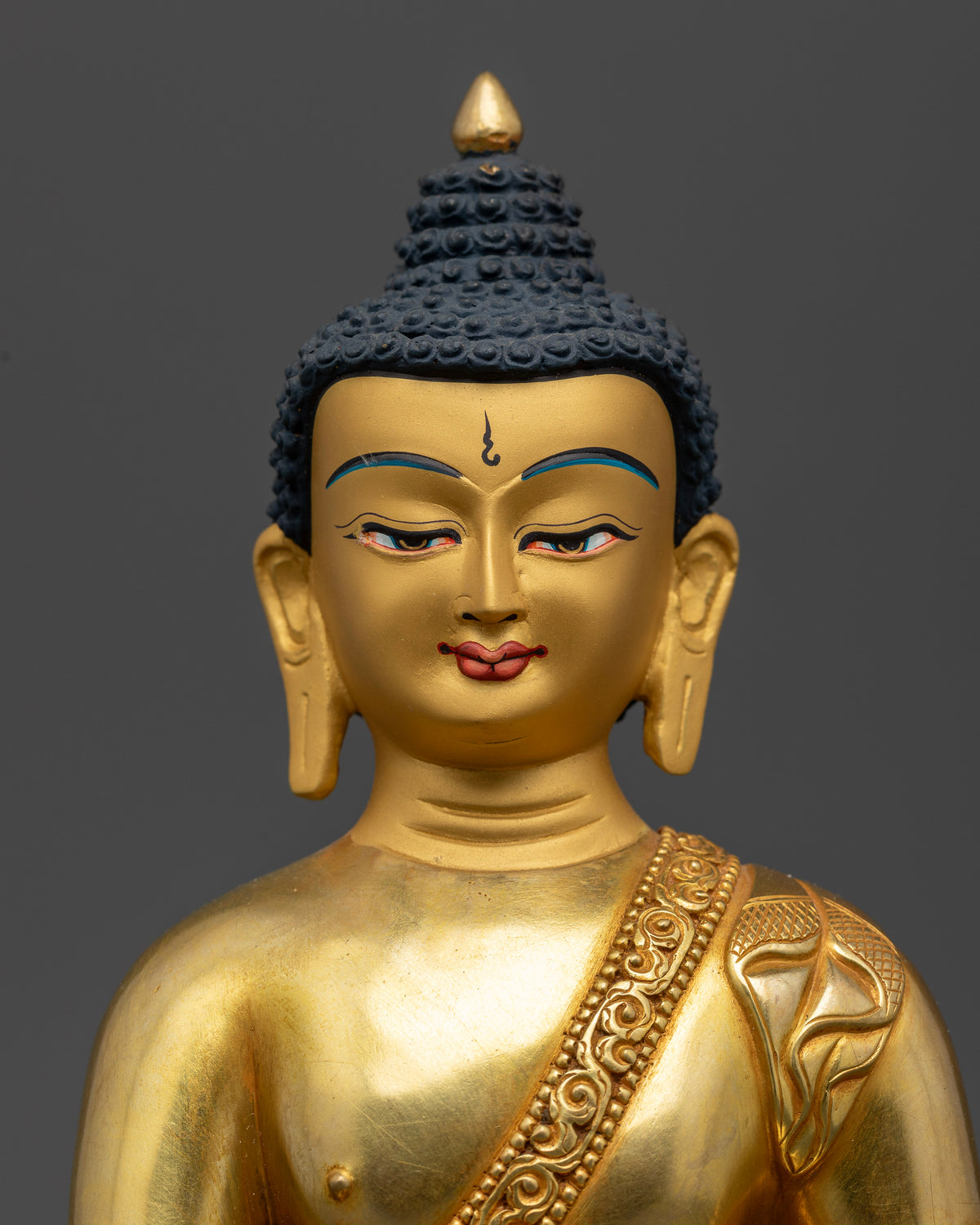 Detailed medicine buddha face with calm expression and gold fire gilded finish.