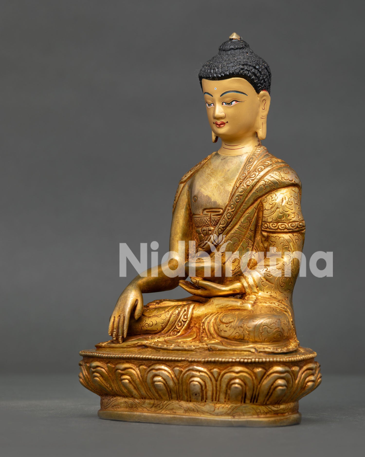 Detailed Shakyamuni Buddha statue with Bhumisparsha mudra holding traditional begging bowl on lotus pedestal.