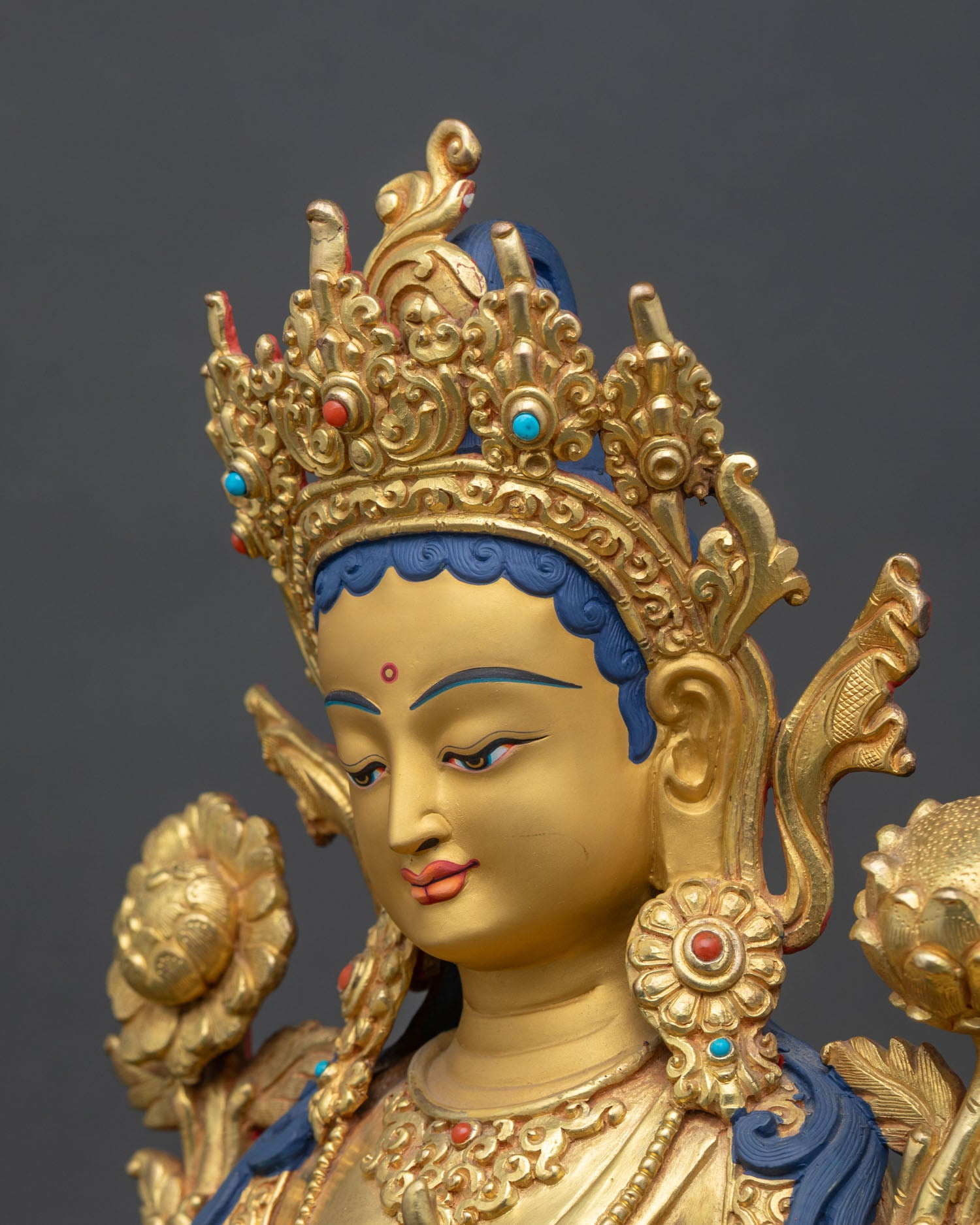 detailed side close-up of green tara face, fire-gilded copper, wish-granting utpala lotus