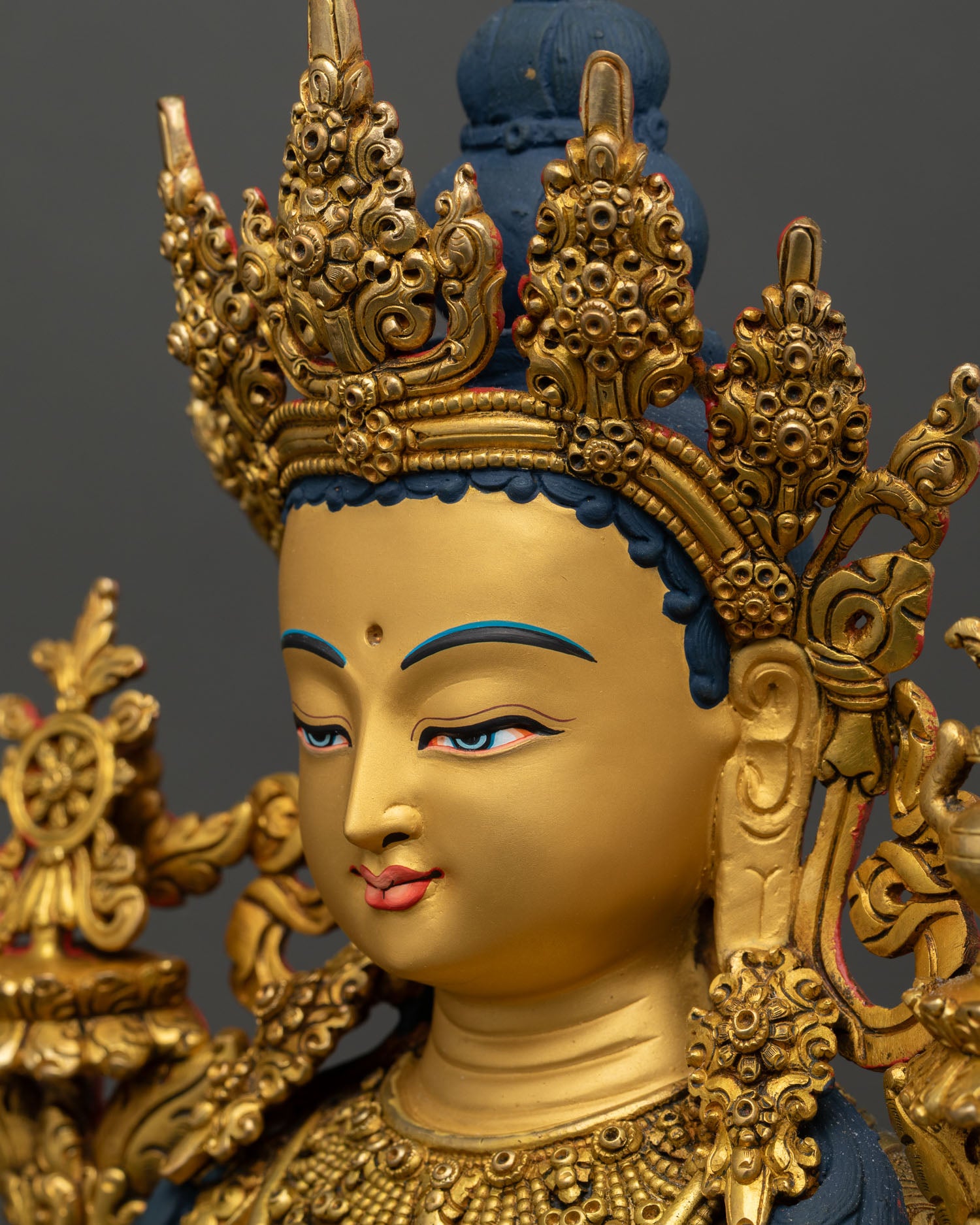detailed side close up of maitreya statue, throne carvings with naga garuda motifs