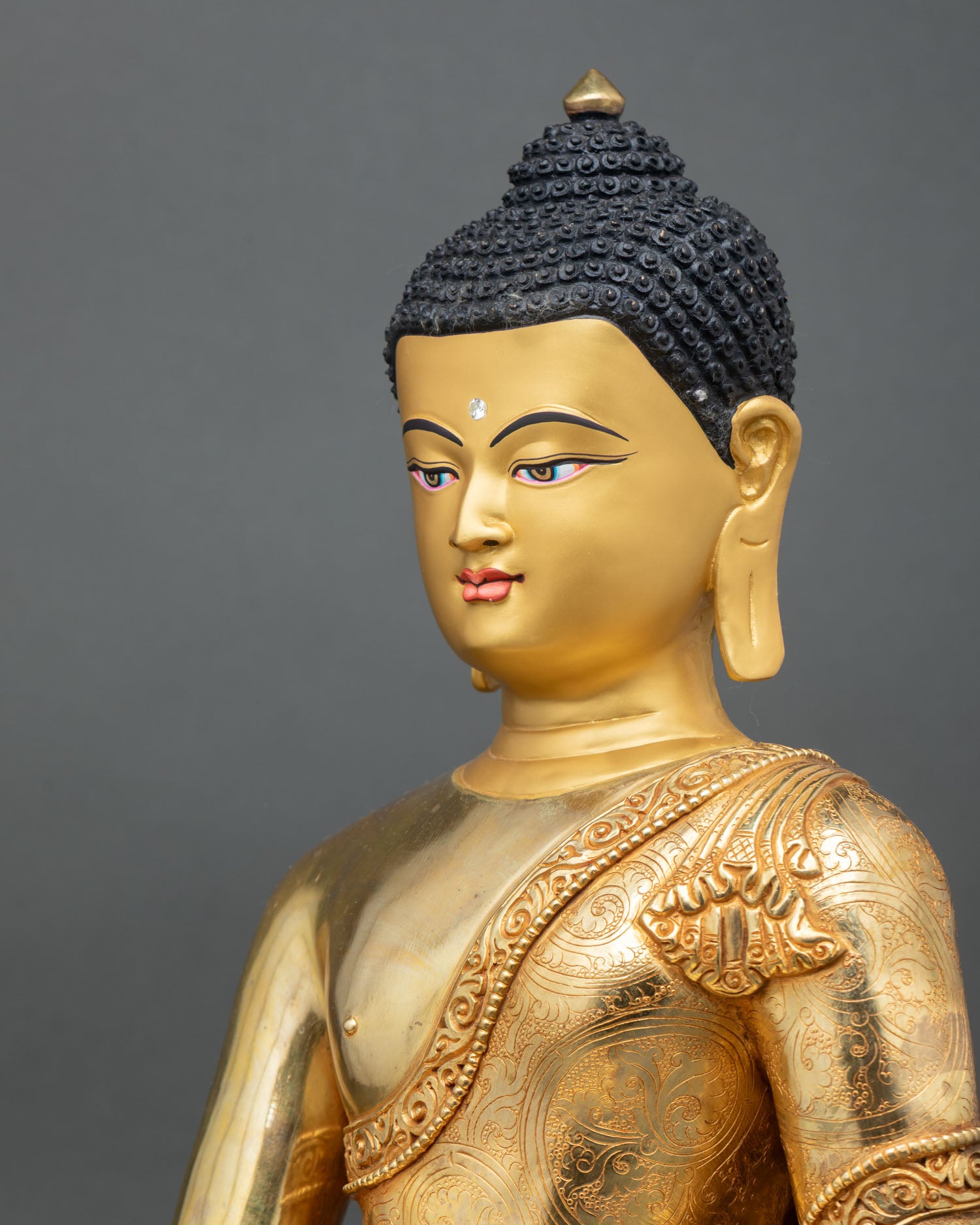 detailed side close up of Shakyamuni Buddha statue with floral halo and ornaments