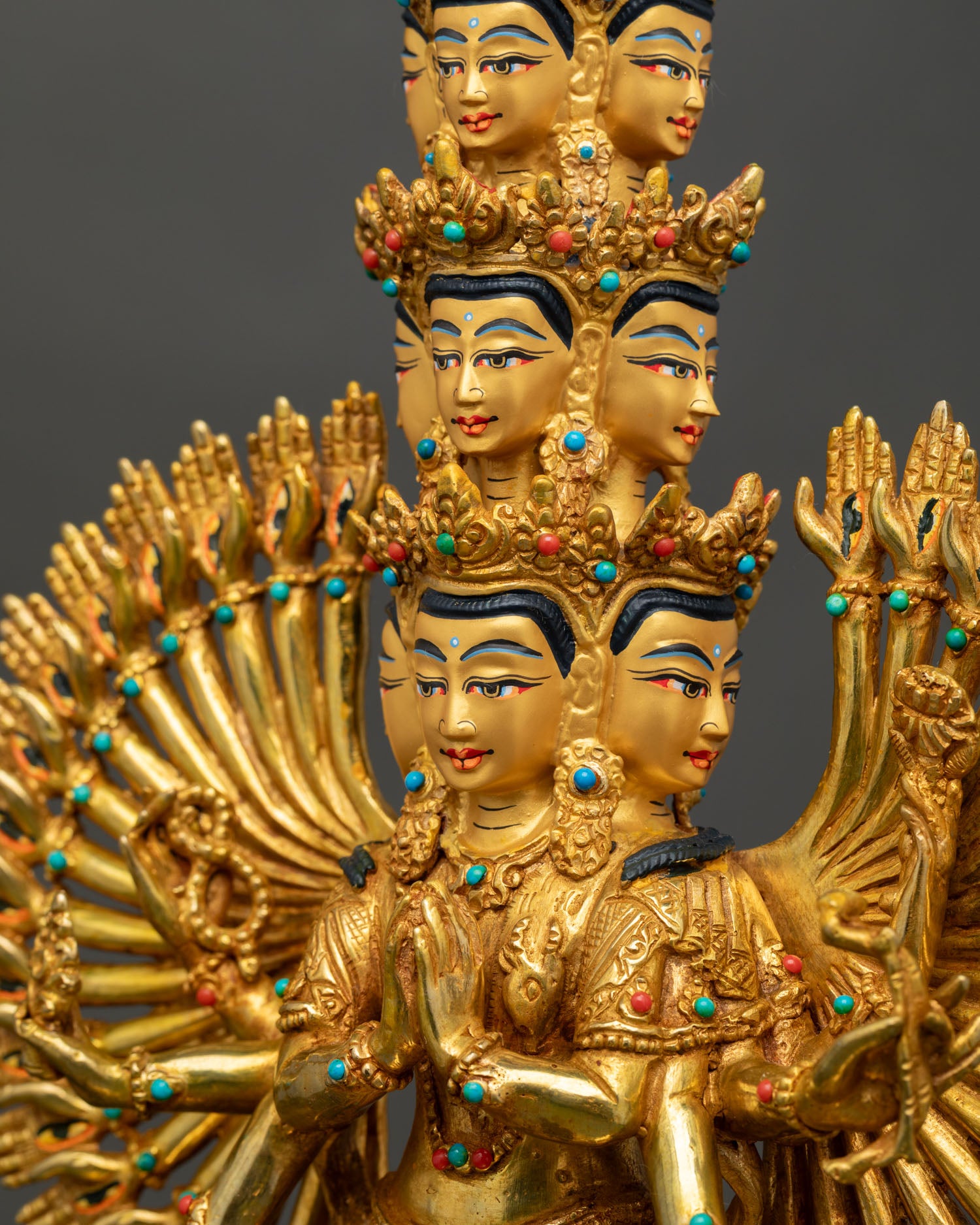 Detailed side close-up of Thousand-Armed Avalokiteshvara statue with repoussé craftsmanship