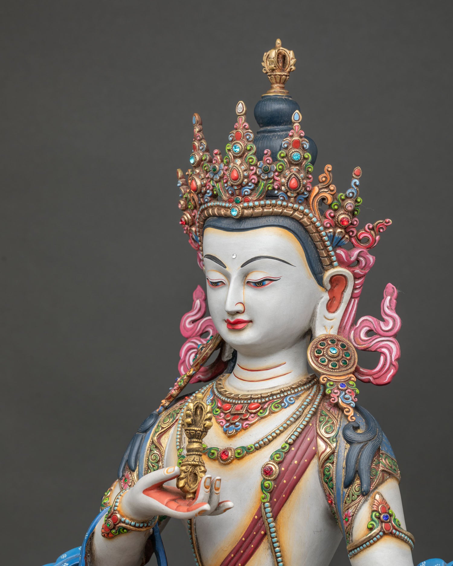 detailed side view of vajrasattva statue with lotus throne and sacred jewelry