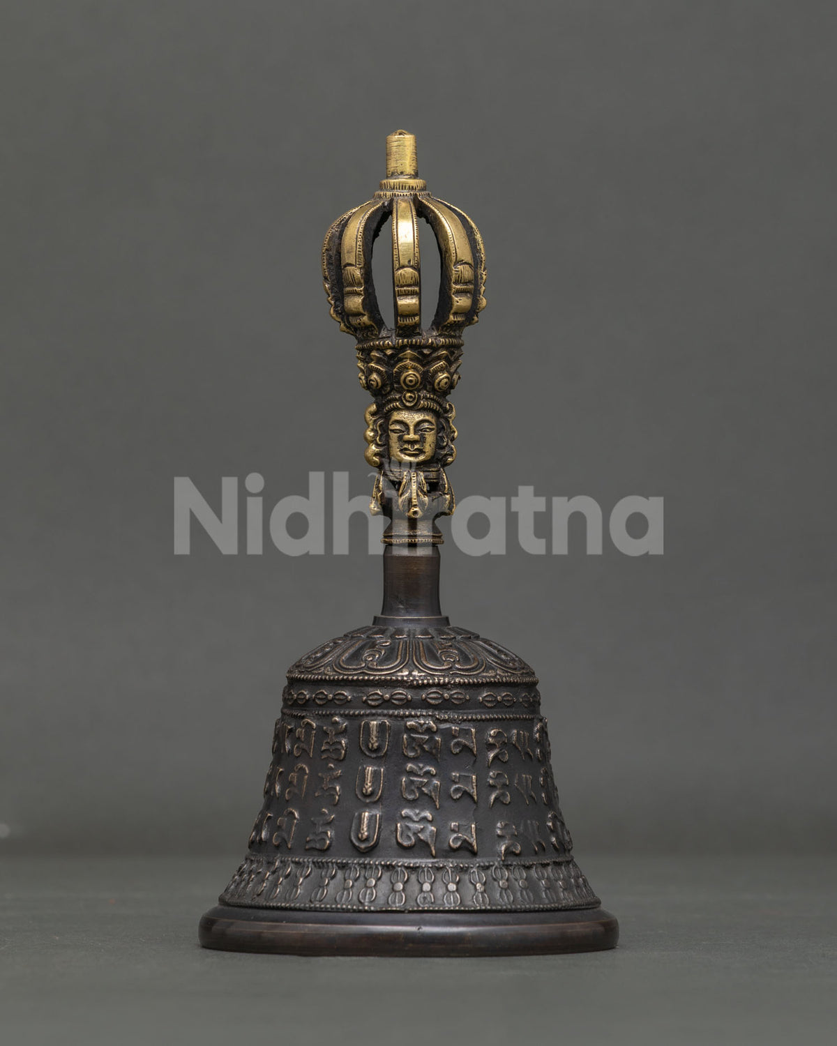 Detailed Vajrayana Bell showing antique finish and traditional nepalese metalwork.