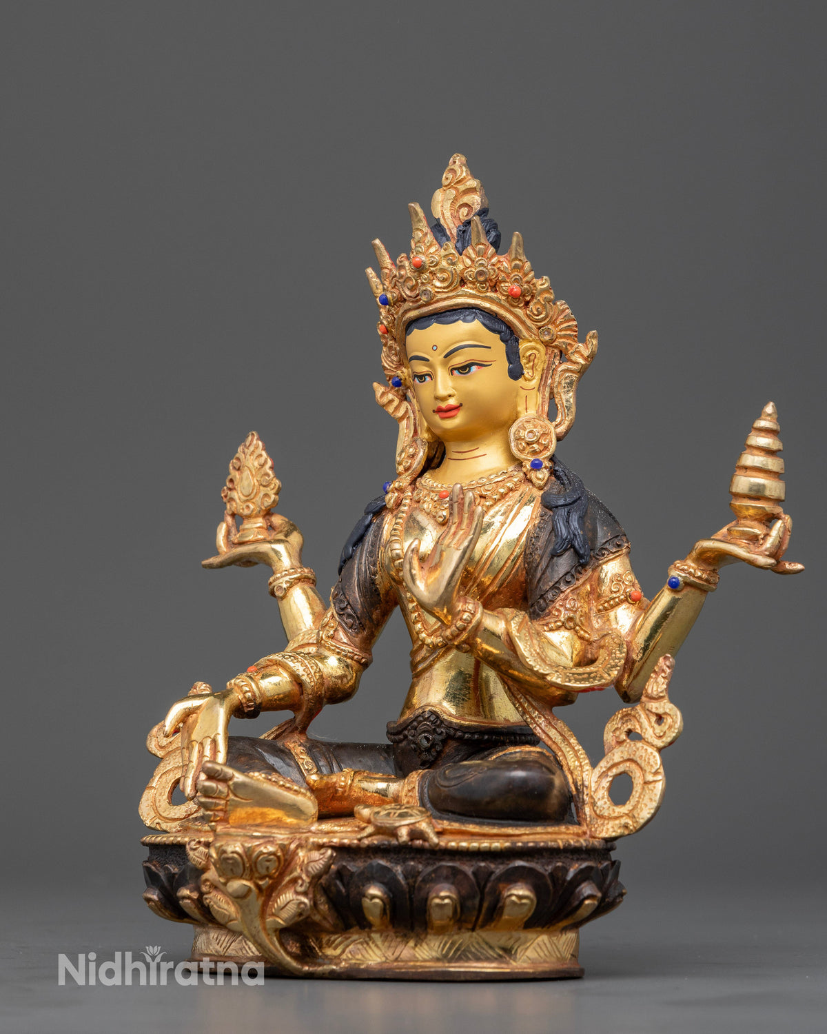 Detailed view of Goddess Laxmi sculpture featuring a pot of gold, and ornate copper craftsmanship