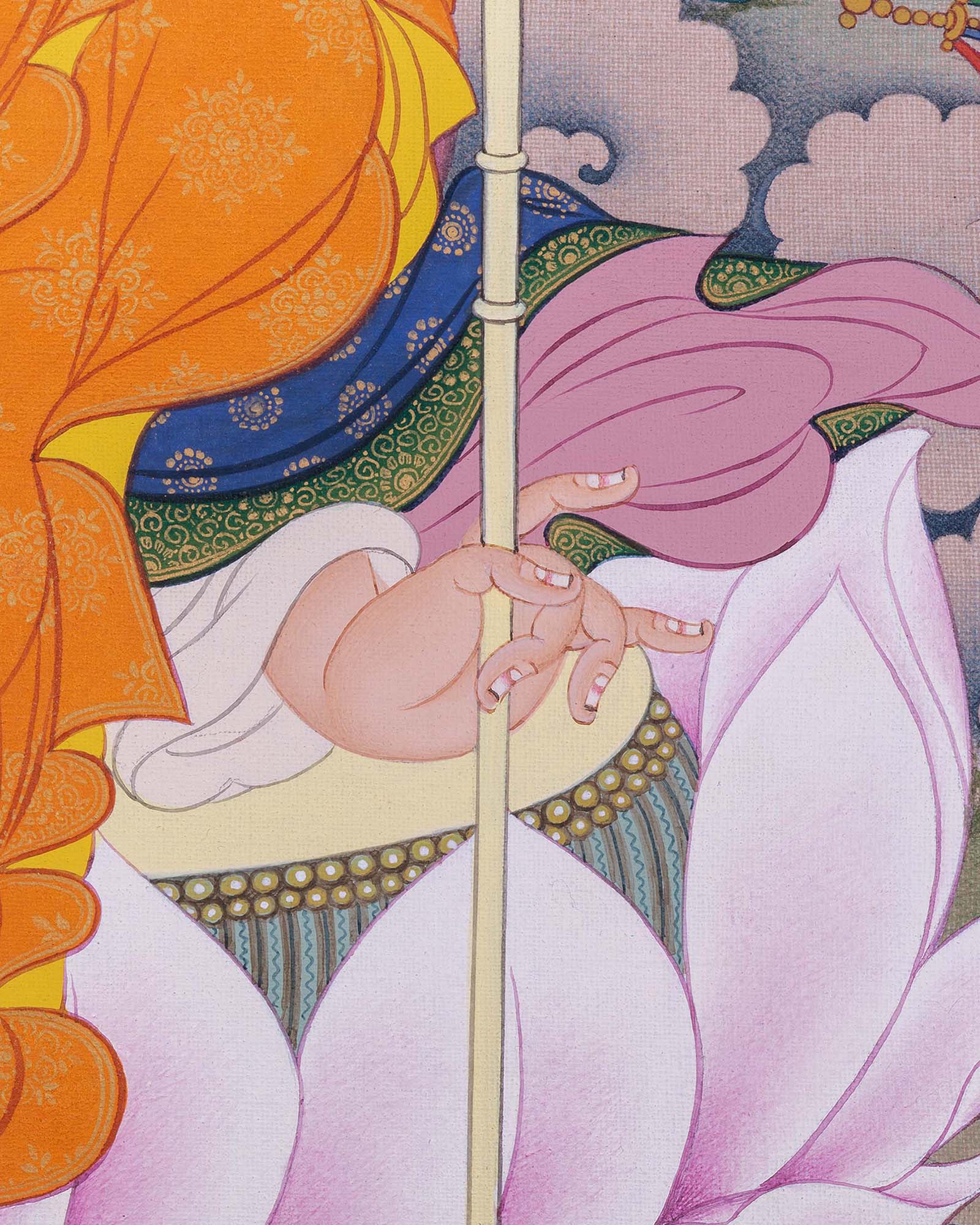 Detailed view of Guru Rinpoche hand holding khatvanga staff on lotus seat in thangka print