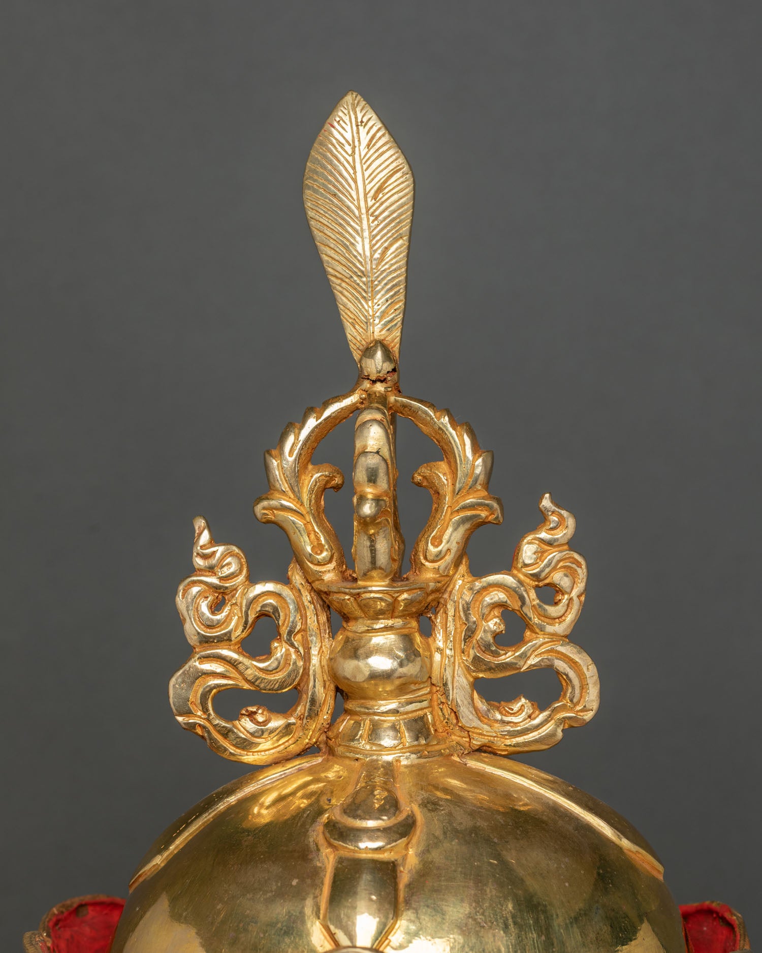 Detailed view of Guru Rinpoche lotus hat with gold gilded finish and intricate vulture feather craftsmanship
