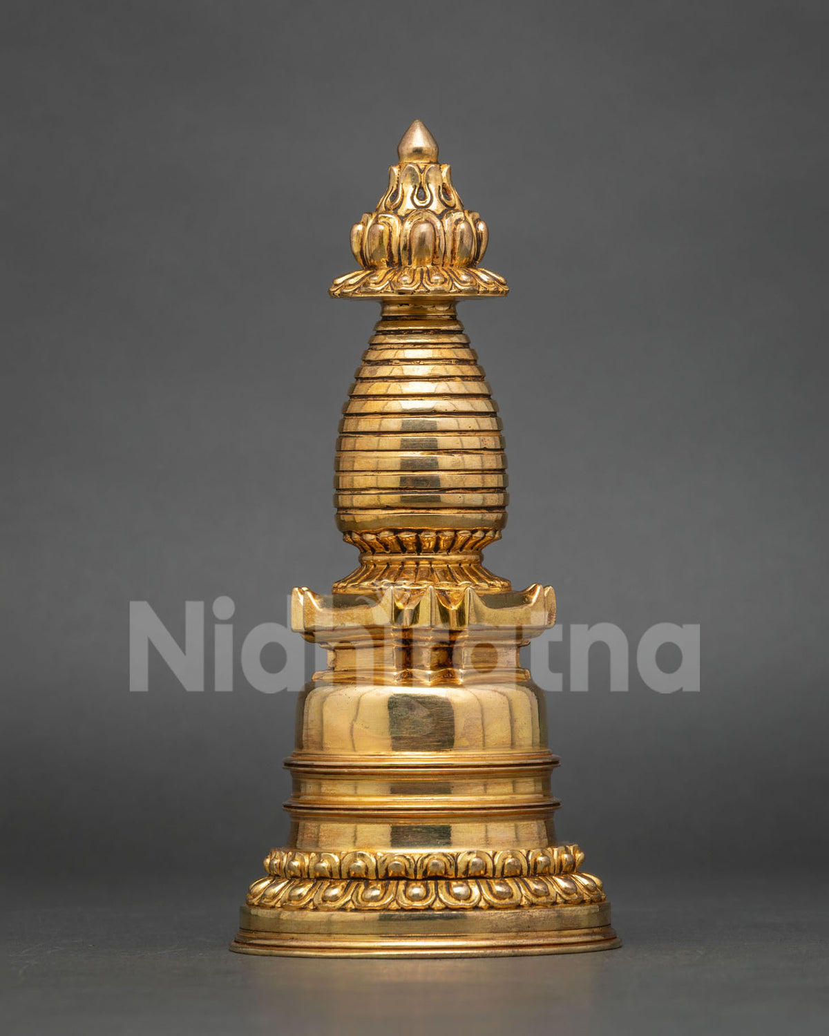 Detailed view of traditional Newari craftsmanship on a gold-plated Buddhist Kadampa Stupa