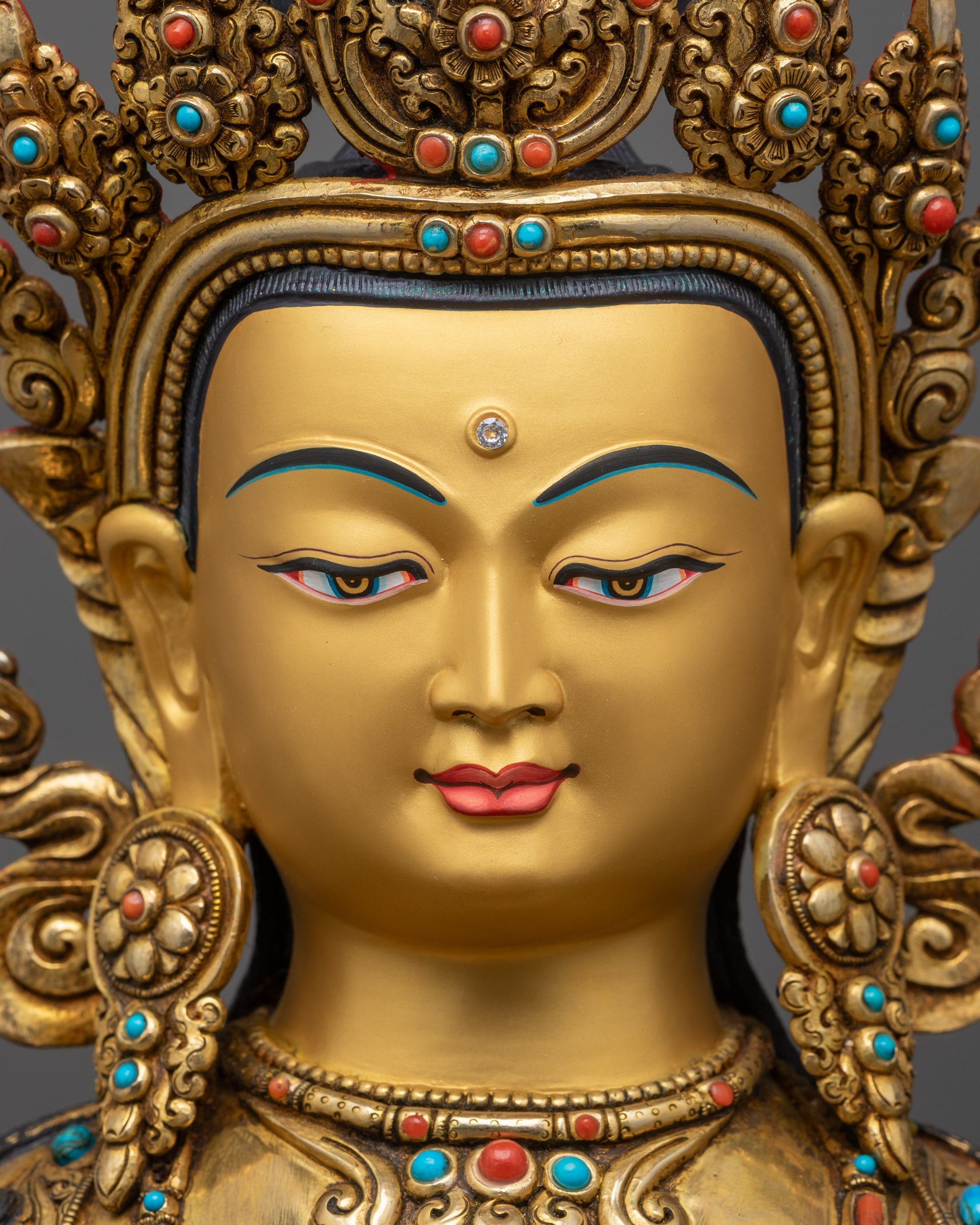 detailed close up face Chenrezig statue with serene expression, halo and semi-precious crown