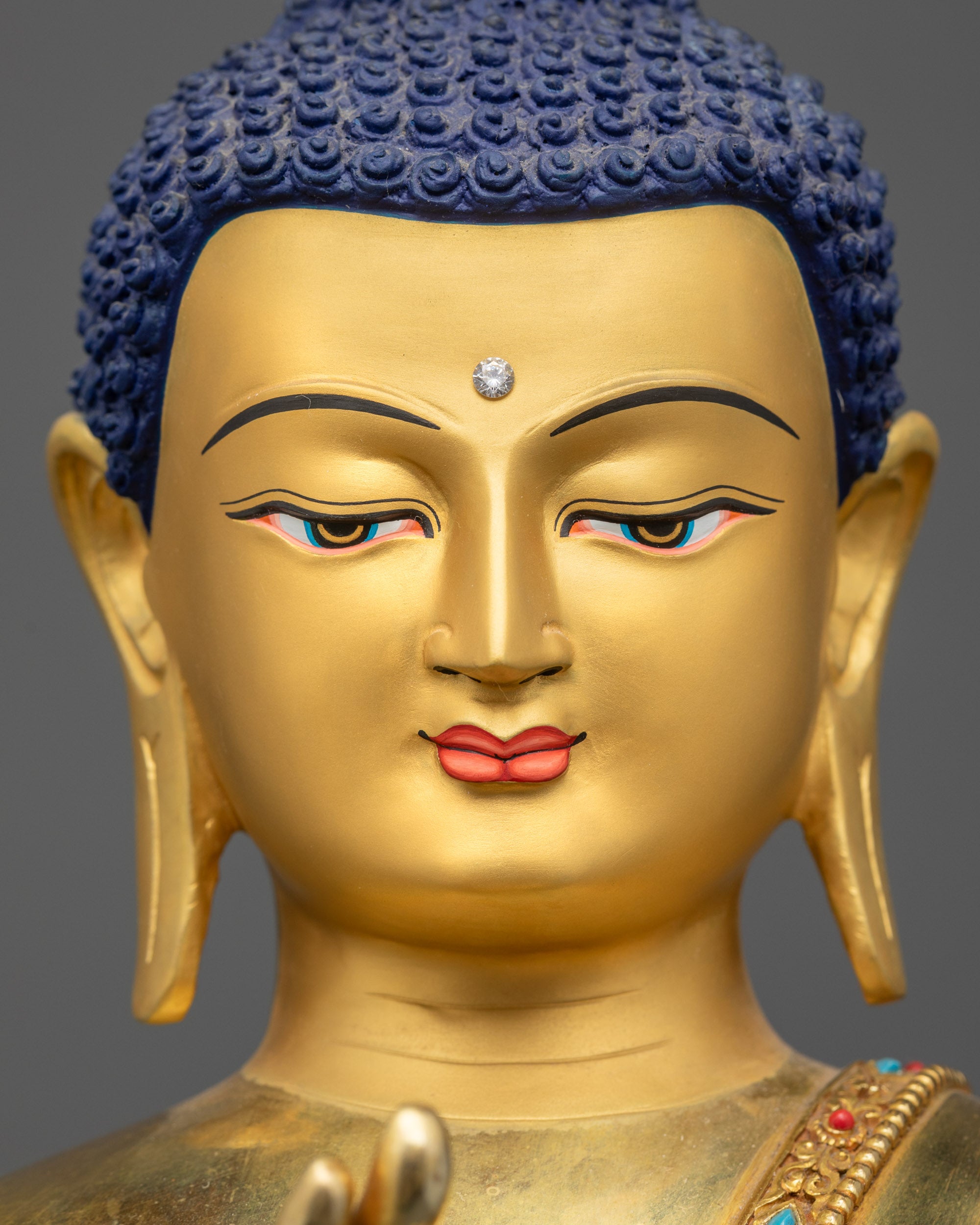 detailed close up face Suvarnabhadra Vimala gold gilded face and monk robe details