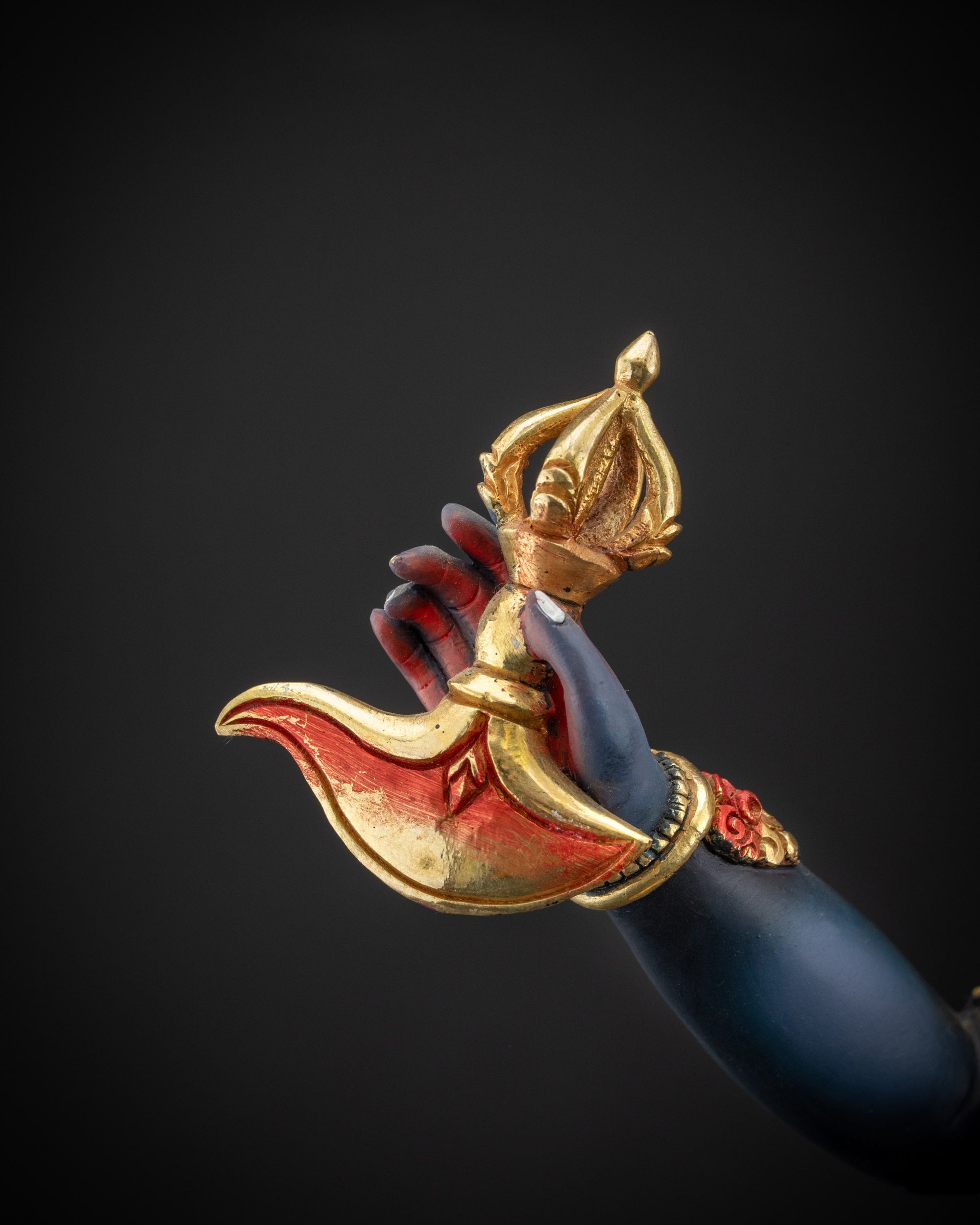 detailed kartika knife Simha Mukha statue holding kartaika knife with symbolic detail