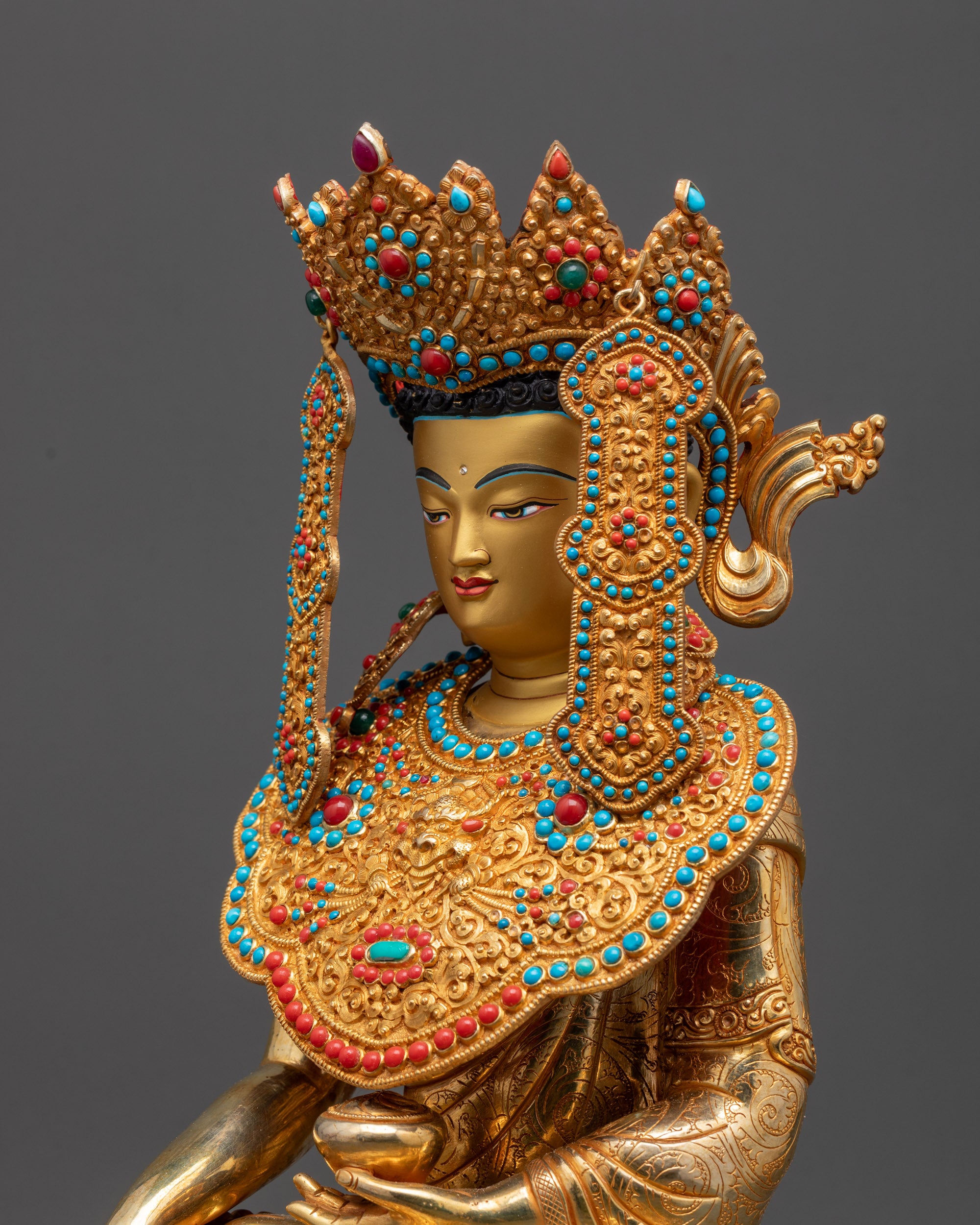 detailed side Jowo Shakyamuni statue showing intricate floral carvings and gemstone embellishment
