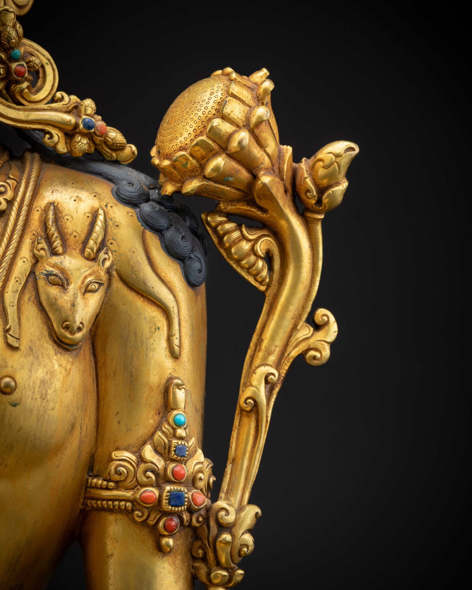 detailed utpala flower chenrezig statue with blooming lotus beside shoulder
