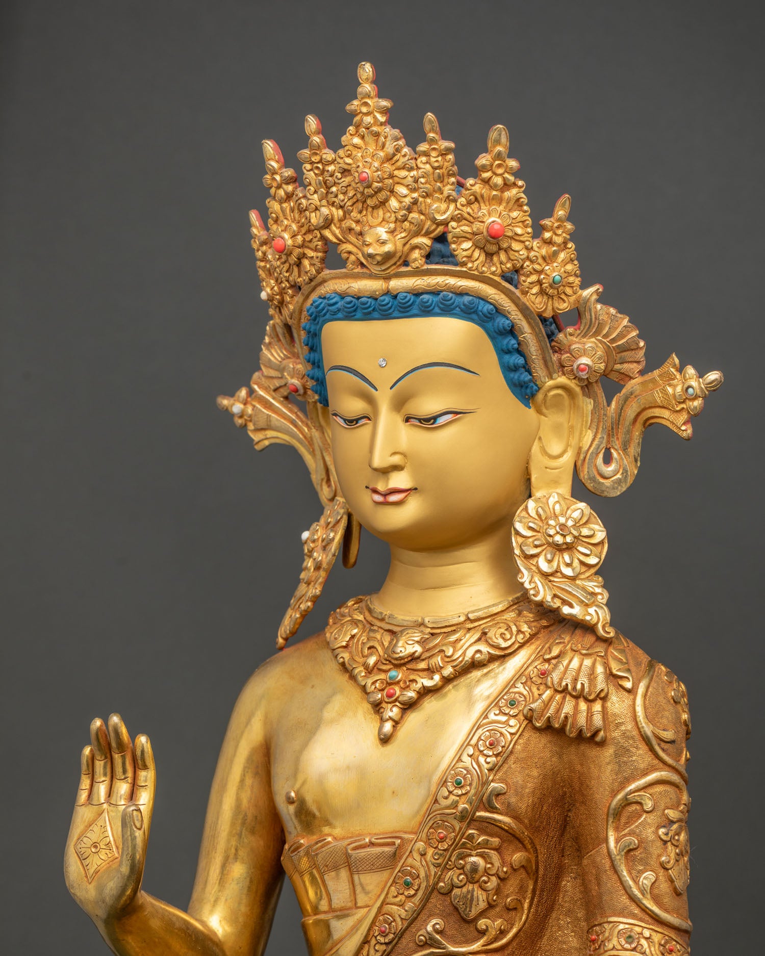 Dipankara Buddha statue detailed side close up showing lotus robe patterns and gemstone ornaments
