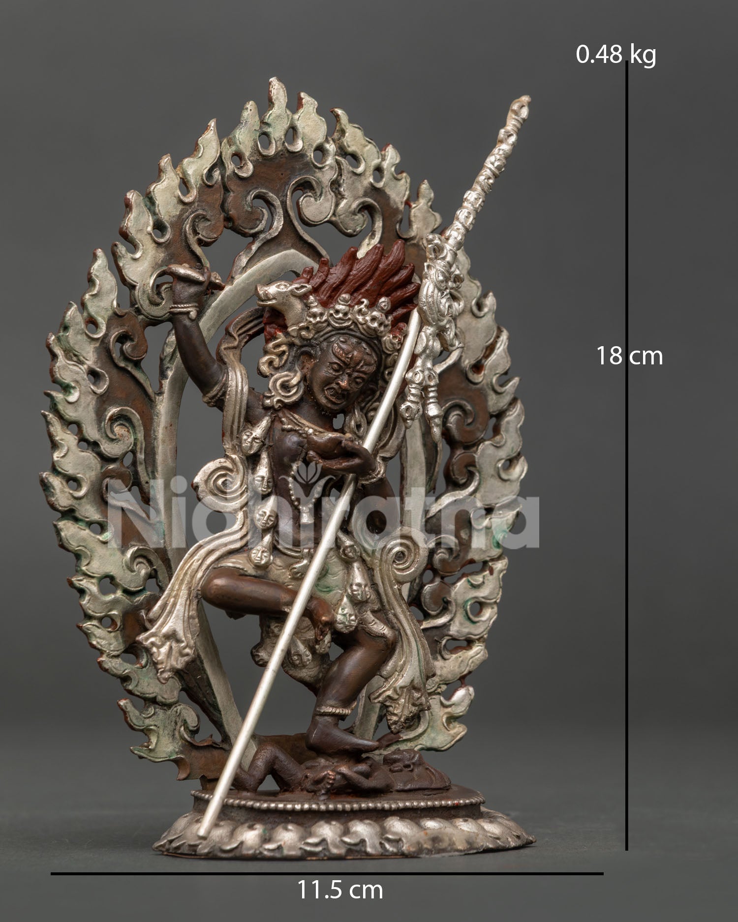 Dorje Phagmo dancing above subdued figure on lotus pedestal.