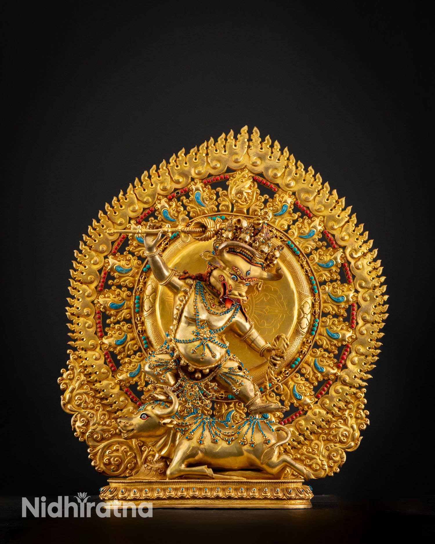 Dynamic posture view of Yamantaka Yab Yum consort union wrathful deity sculpture standing on buffalo symbolizing transformation.