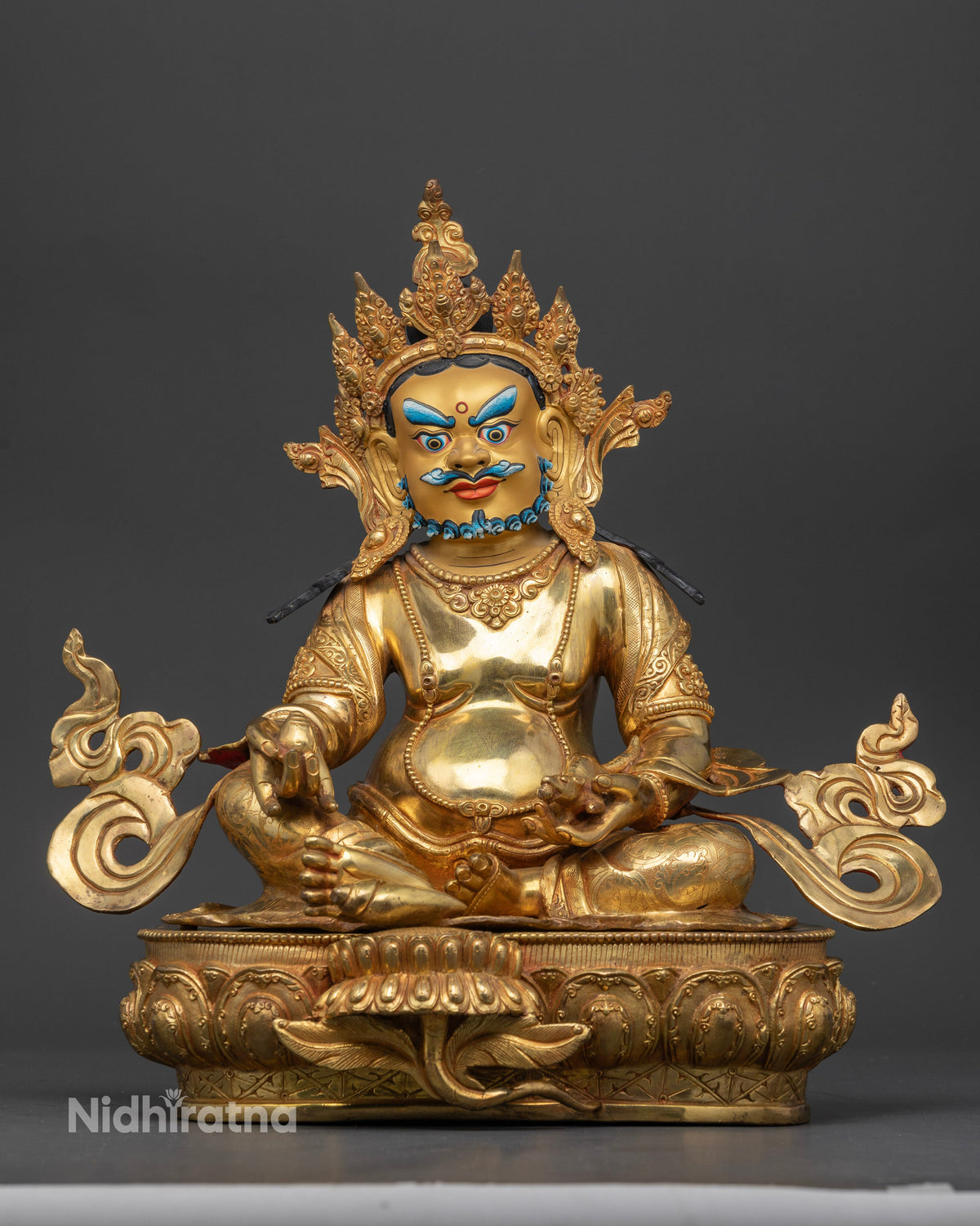 Dzambhala statue Buddhist deity of wealth gold fire gilded copper.